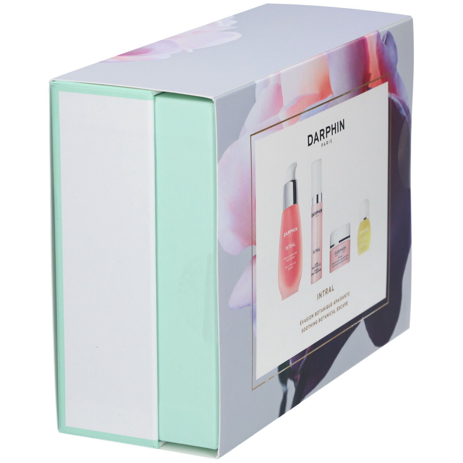Cadeaudoos met bloemenontwerp en vier producten. Opschrift: DARPHIN. Roze vloeistoffen en crèmes. Mintgroene en witte accenten.