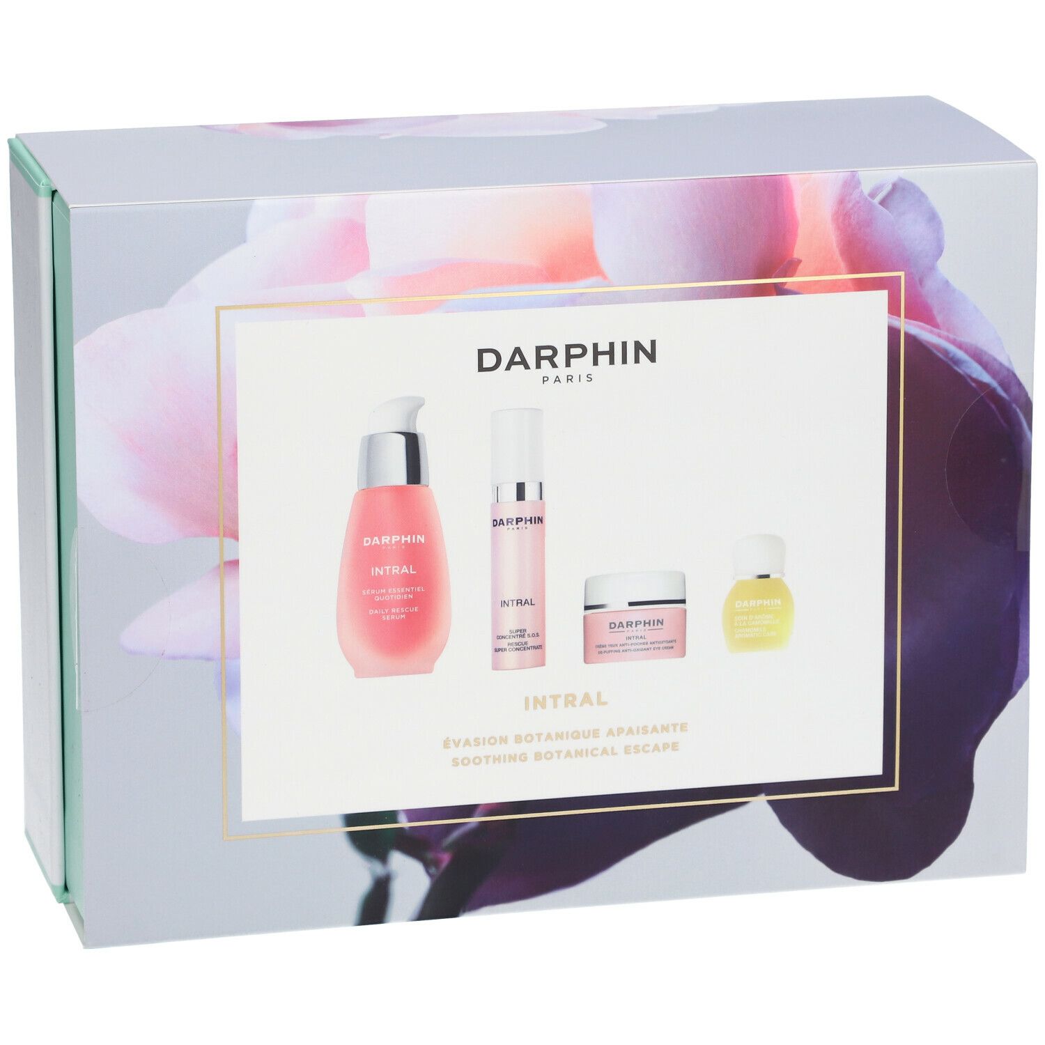 Cadeaudoos met bloemenontwerp en vier producten. Opschrift: DARPHIN. Roze vloeistoffen en crèmes. Mintgroene en witte accenten.