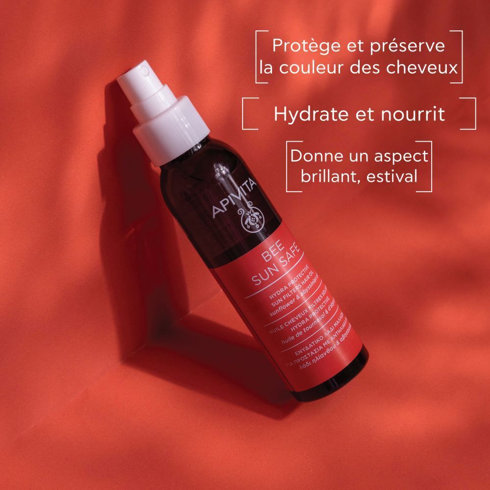 Flacon sur fond rouge. Textes avec les bénéfices du produit. Marque : Apivita.