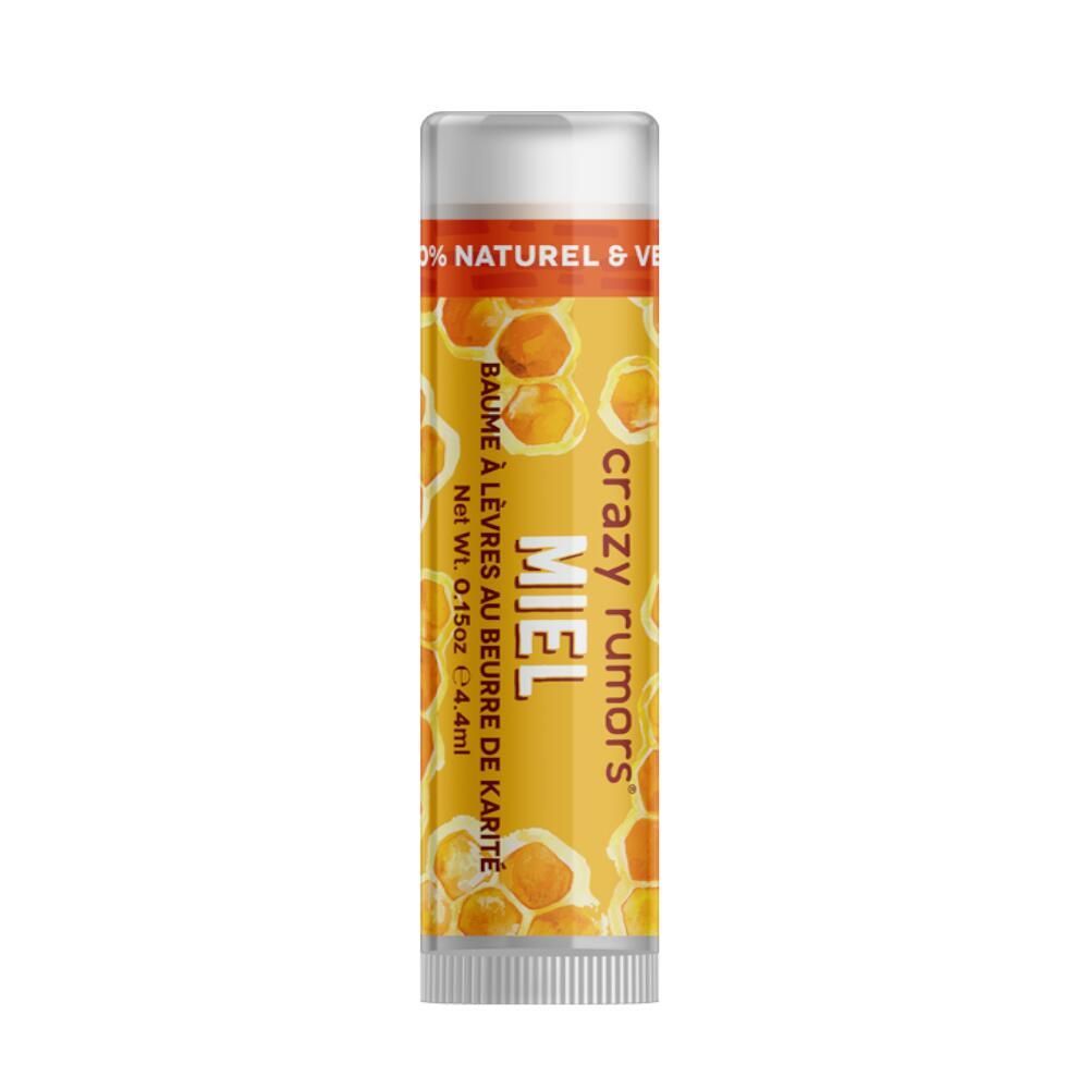 Lippenpflegestift mit Honig-Design. Gelbe Verpackung mit Produktnamen und Text. Transparenter Deckel.