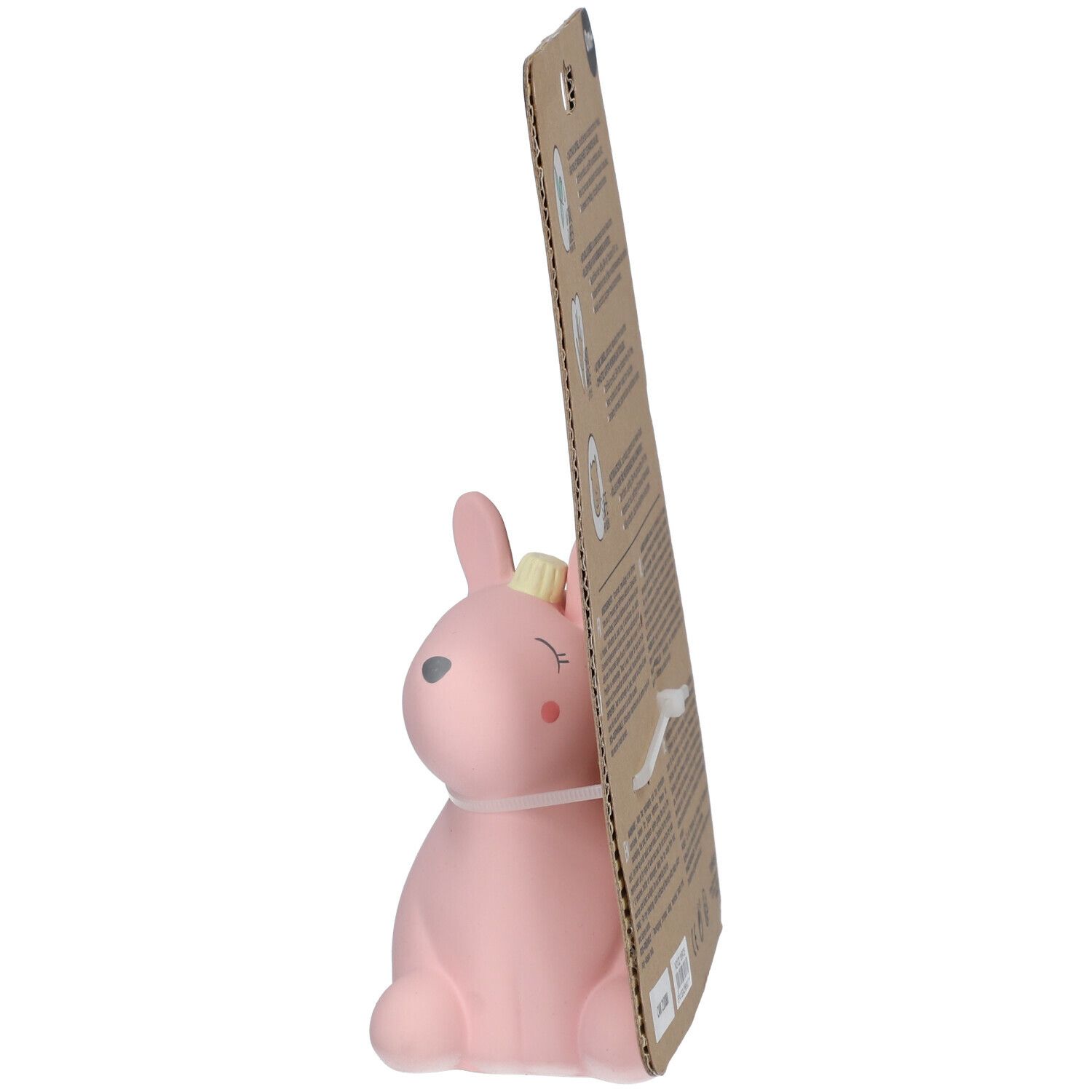 Rosa Hase aus Naturkautschuk, seitliche Ansicht. Auf Pappkarte befestigt.