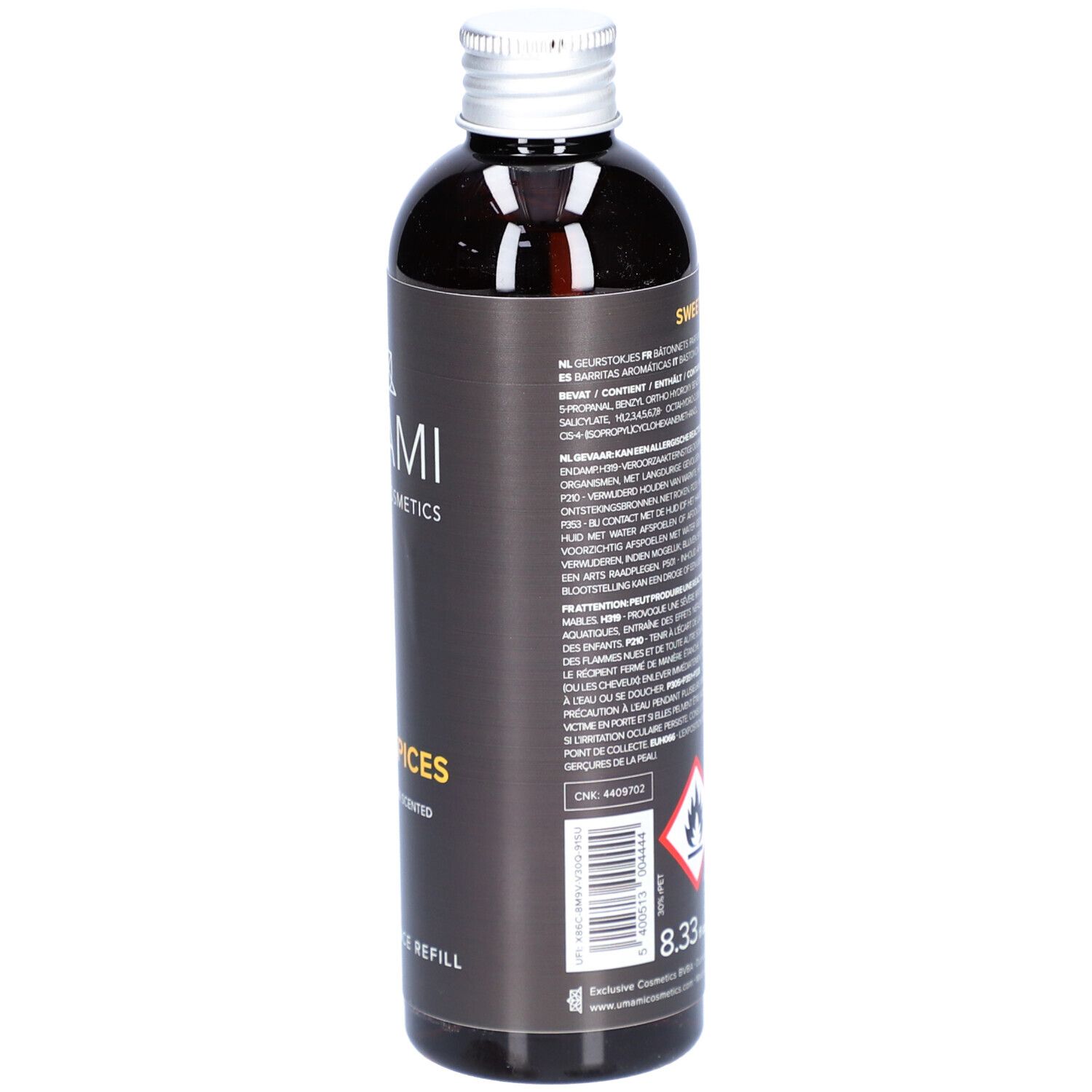 Dunkle Flasche mit silbernem Deckel. Aufschrift: UMAMI, Sweet Spices. Warnhinweise, Text und Barcode.