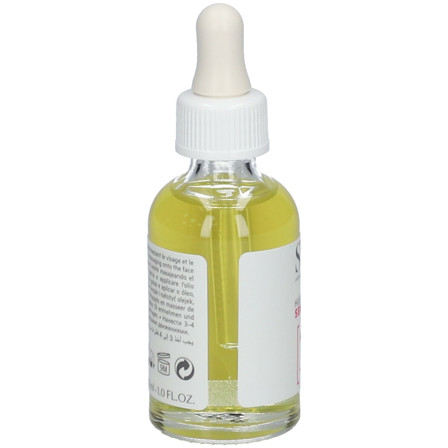 Glazen fles met pipet, gevuld met gele olie. Label: SVR, Huile de Nuit Sensifine, 10 Ingredients. Tekst op achterkant.