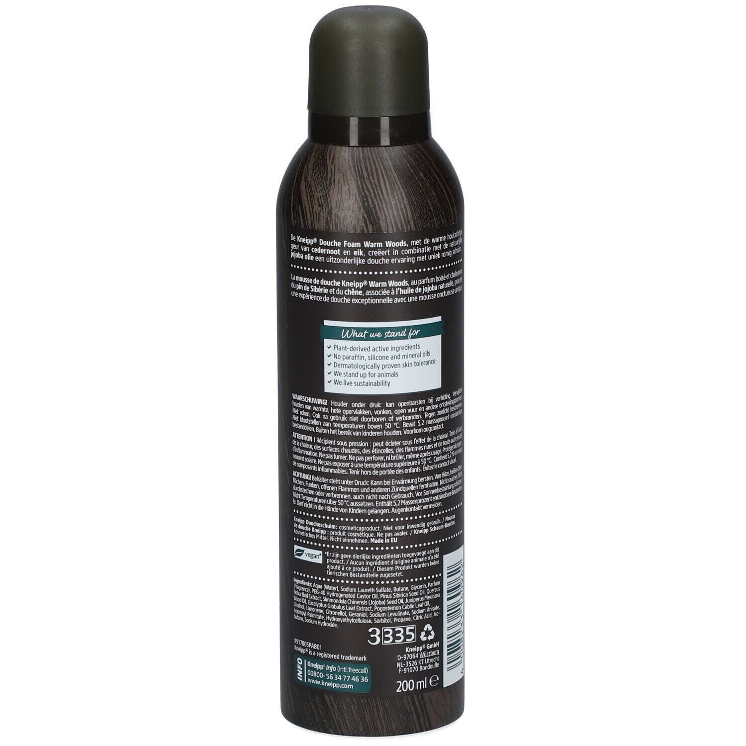 Achterkant van de douche foam fles. Tekst: Kneipp, Warm Woods, ingrediënten, instructies. 200 ml. Groene dop, bruine fles.