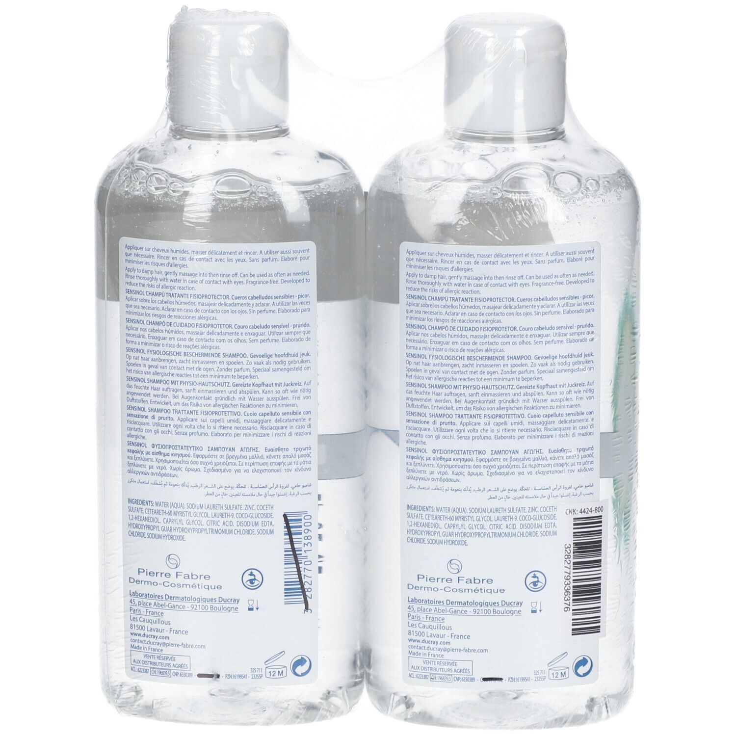 Deux flacons emballés dans du film plastique. Des étiquettes avec du texte, dont le logo de la marque et des informations sur le produit, sont visibles.