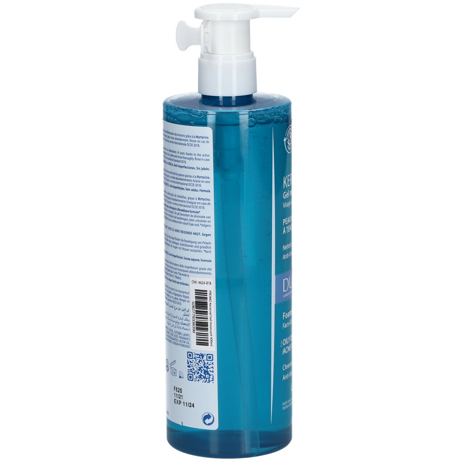 Achterkant van de blauwe fles met tekst. Barcode en QR-code. Opschrift: DUCRAY, KERACNYL, EXP 11/25.