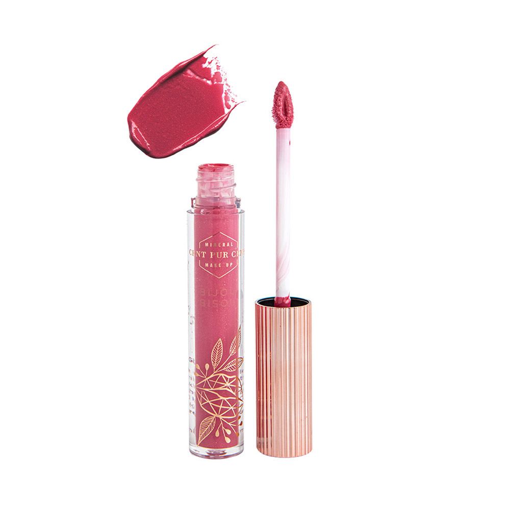 Tube de gloss ouvert avec contenu rose et applicateur. Goutte de gloss à côté. Bouchon doré.