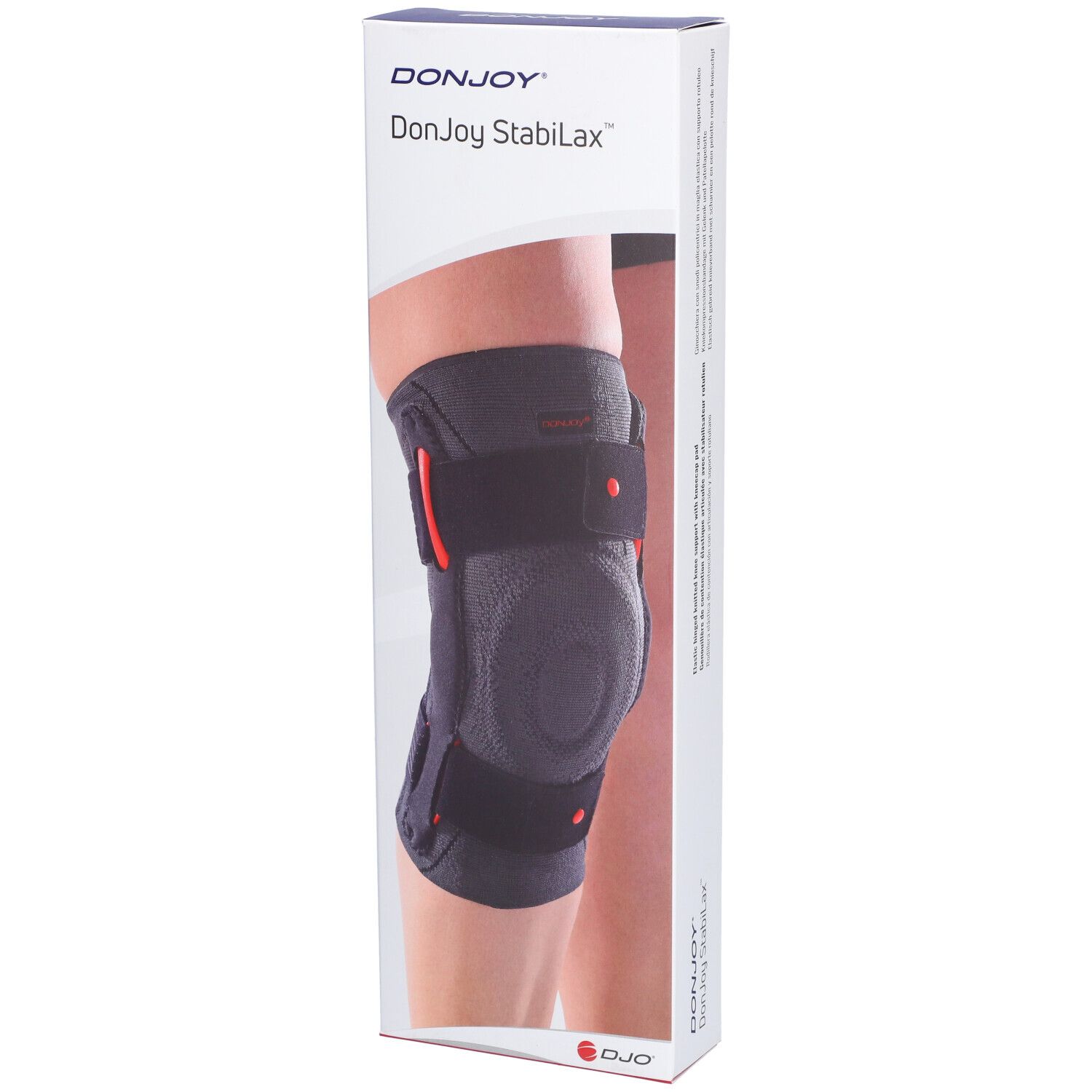 Genouillère DonJoy StabiLax dans son emballage. Bandage gris avec détails rouges et fermetures velcro. Inscription : DonJoy StabiLax.