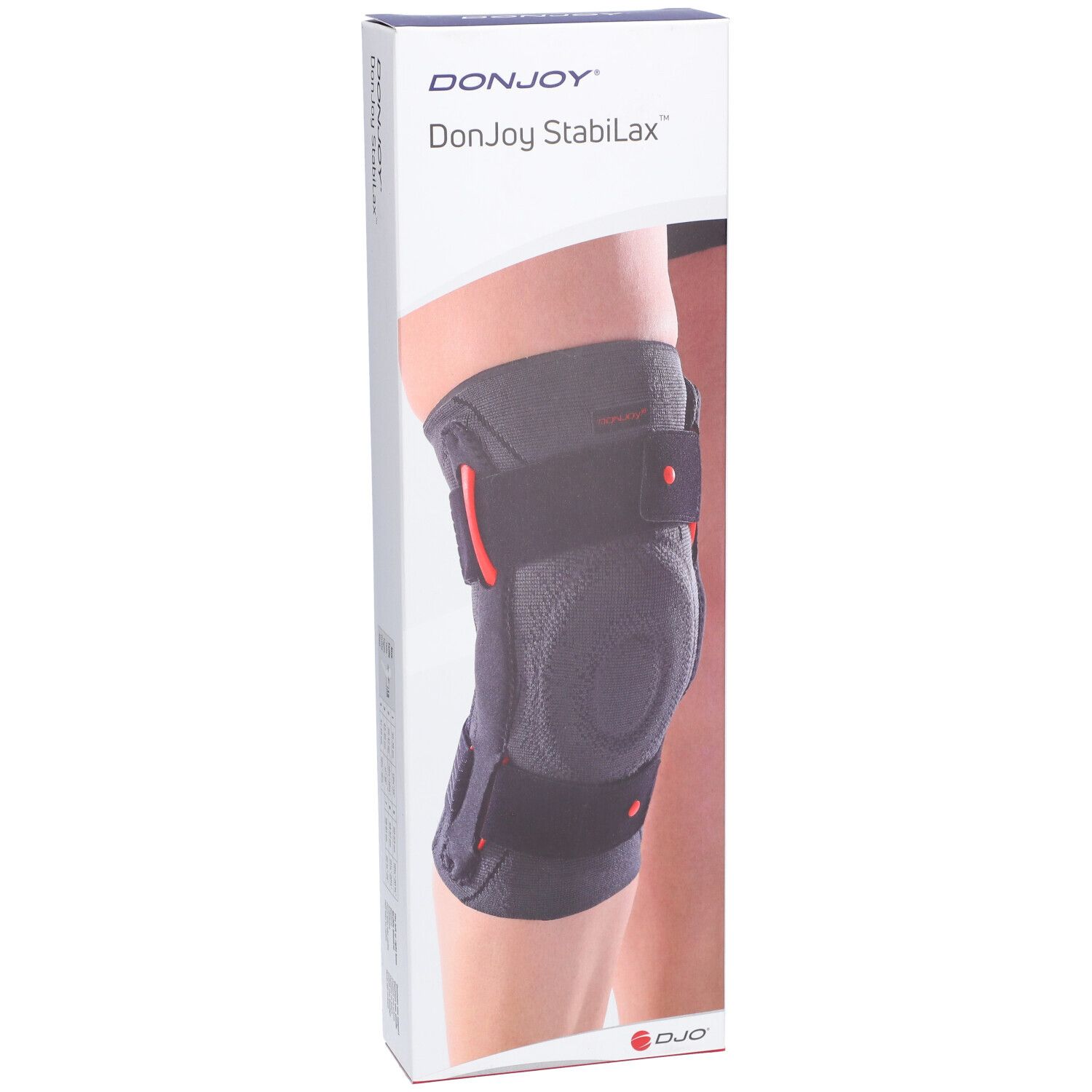 Genouillère DonJoy StabiLax dans son emballage. Bandage gris avec détails rouges et fermetures velcro. Inscription : DonJoy StabiLax.