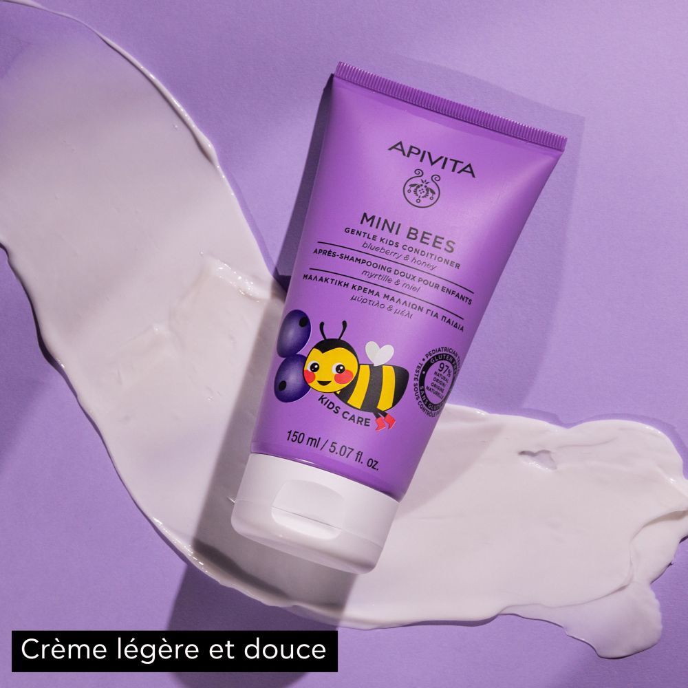 Tube violet. Conditionneur pour enfants. Illustration d'une abeille et myrtilles. Texte: Crème légère et douce.