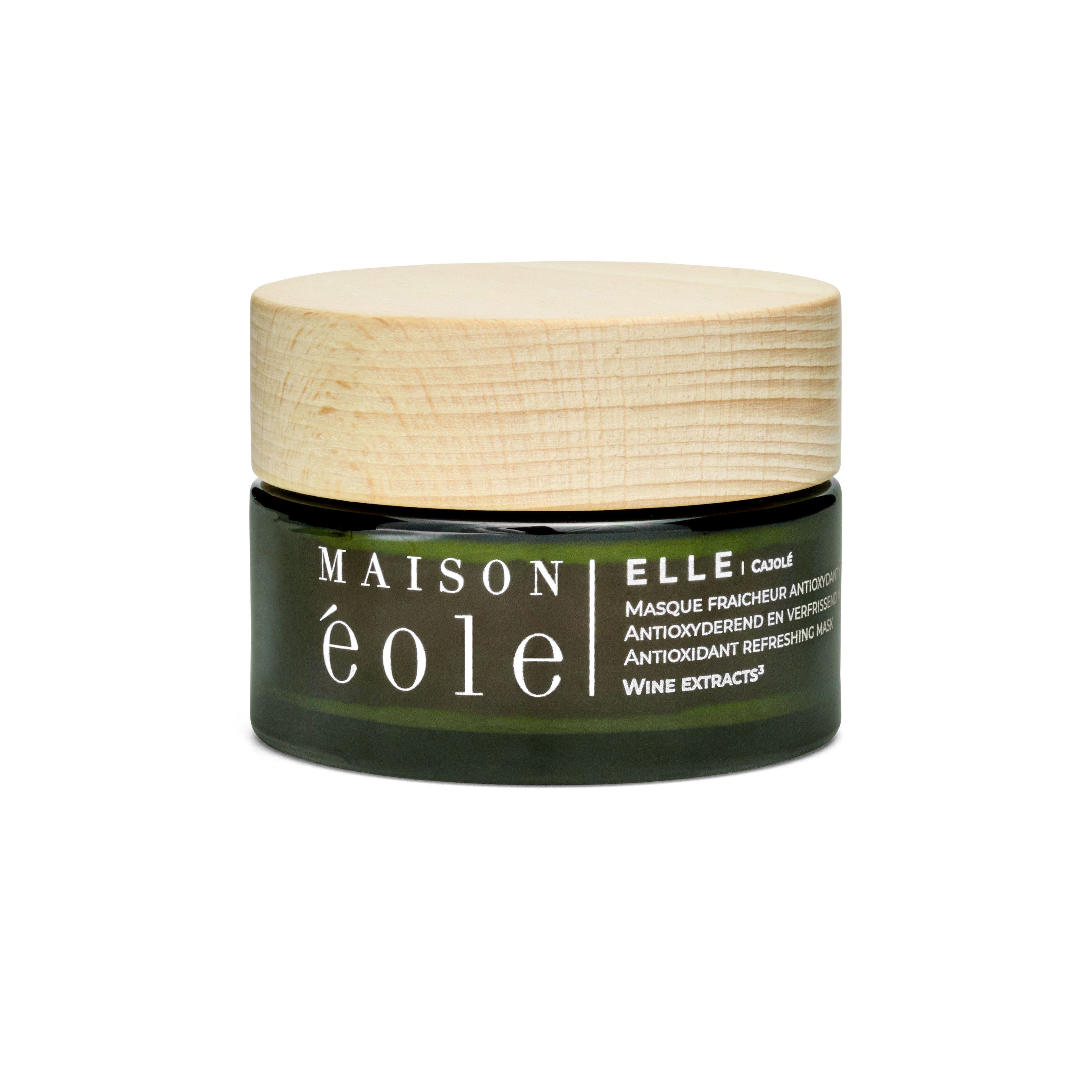 Pot en verre vert avec couvercle en bois. Inscription: Maison Éole, Ellei Cajole, masque antioxydant.