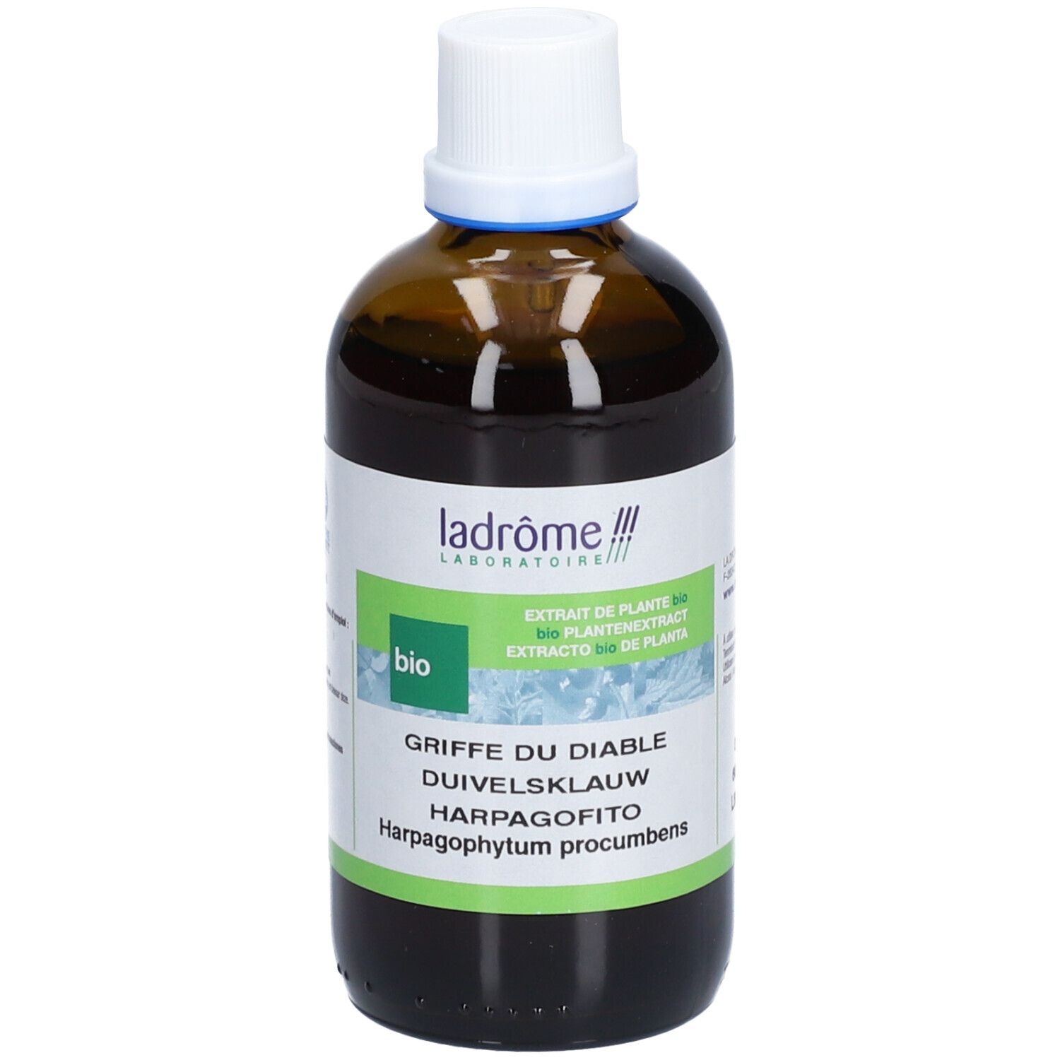 Bruine glazen fles met witte dop. Etiket met productnaam en bio-keurmerk. Tekst in het Frans, Duits, Nederlands en Italiaans.