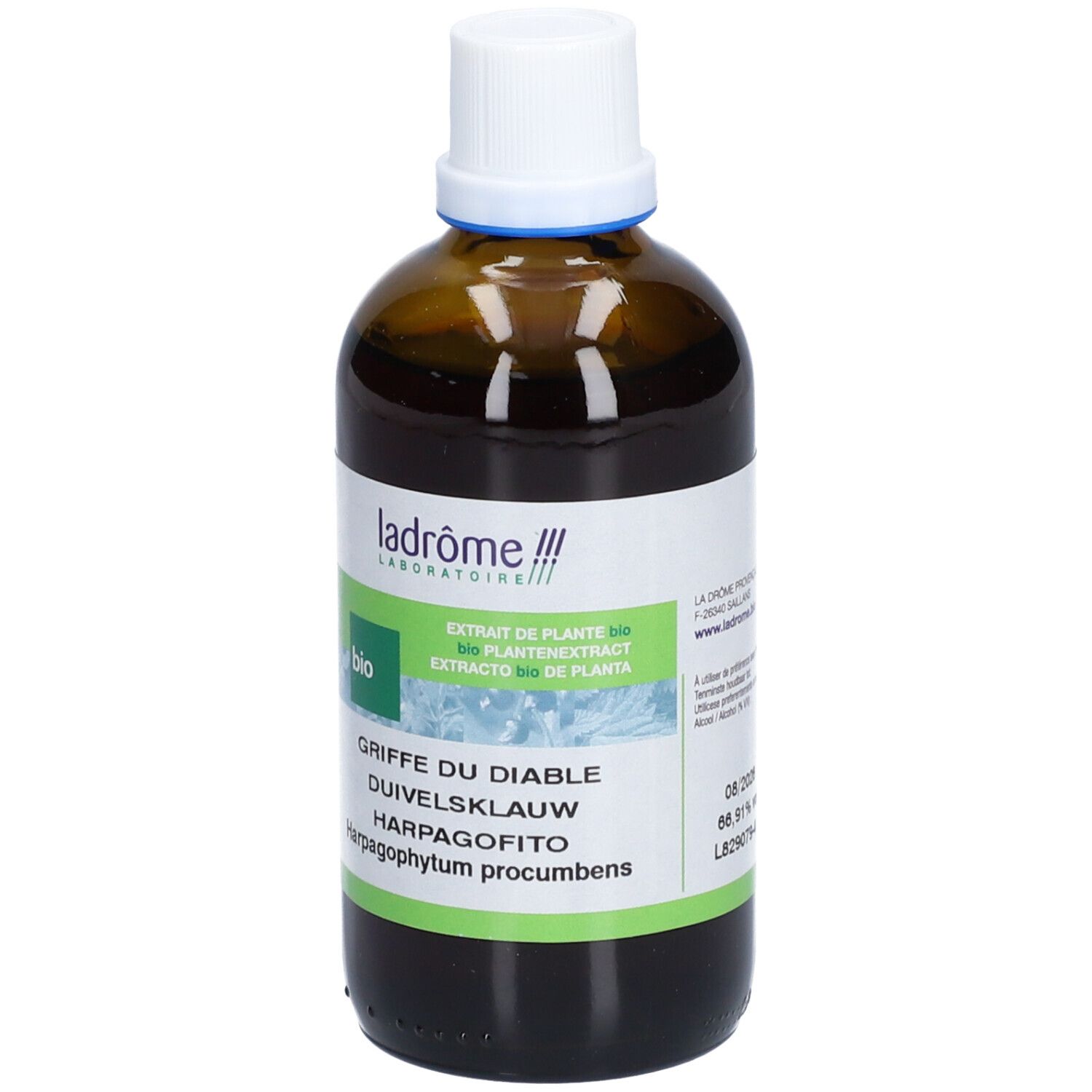 Bruine glazen fles met witte dop. Etiket met productnaam en bio-keurmerk. Tekst in het Frans, Duits, Nederlands en Italiaans.