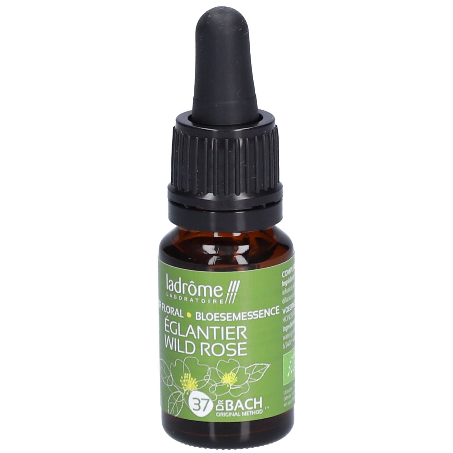 Flacon en verre brun avec compte-gouttes noir. Étiquette avec nom du produit, rose sauvage et logo.