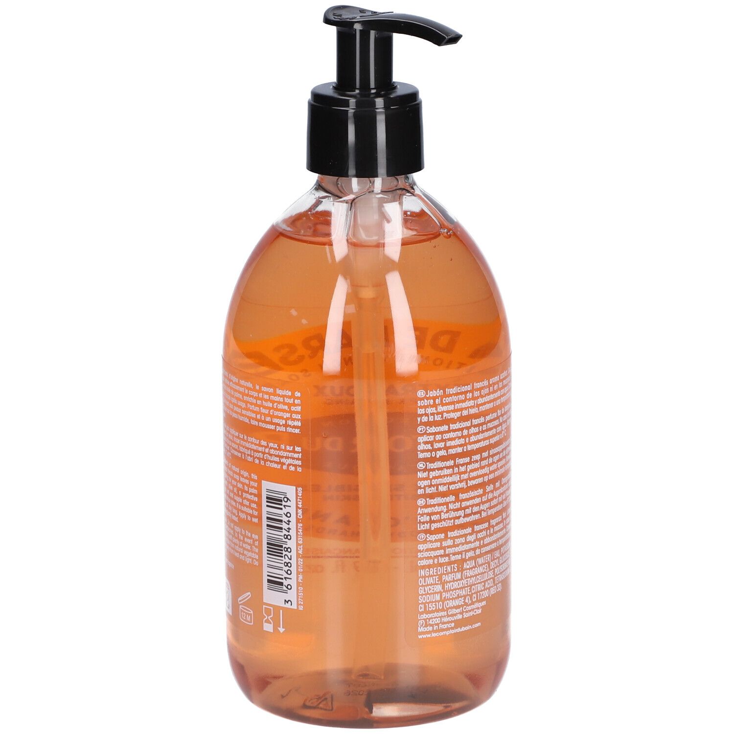 Rückseite der Seifenflasche. Text auf Etikett. Schwarzer Pumpkopf. Transparente Flasche mit orangefarbener Flüssigkeit.