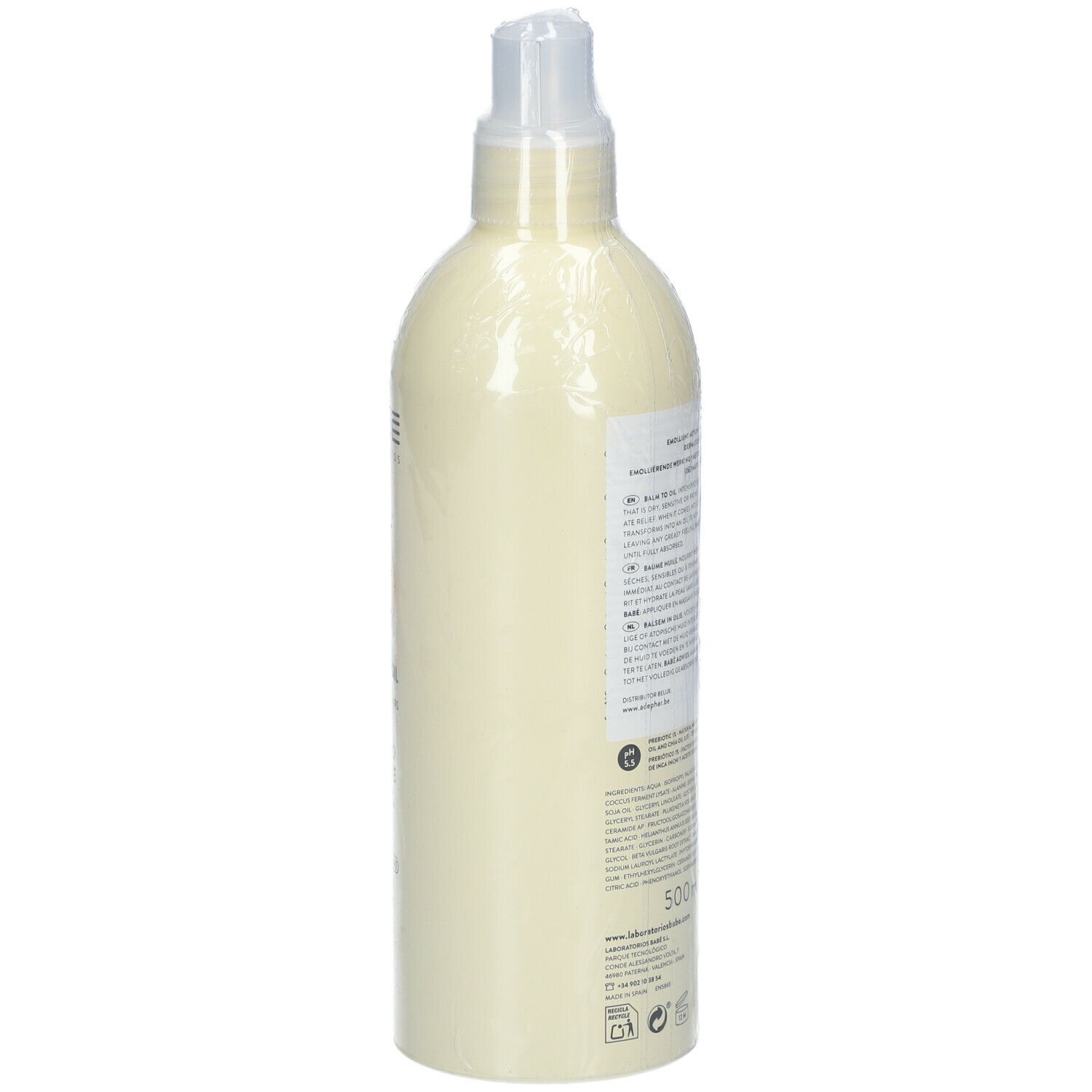 Flacon beige avec pompe, vue latérale. Texte sur l'étiquette. Emballé dans du film plastique.