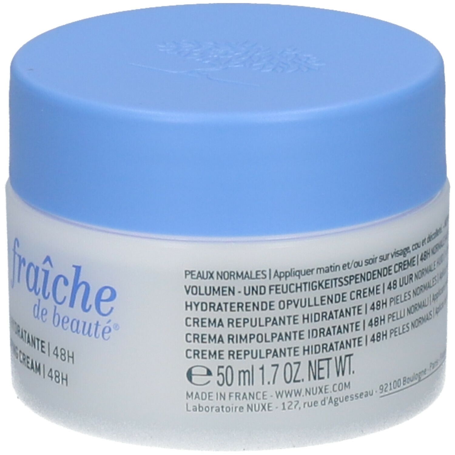 Pot de crème avec couvercle bleu. Inscription : Crème fraîche de beauté, 50 ml, 1.7 OZ. Net. WT. Texte avec instructions d'utilisation.