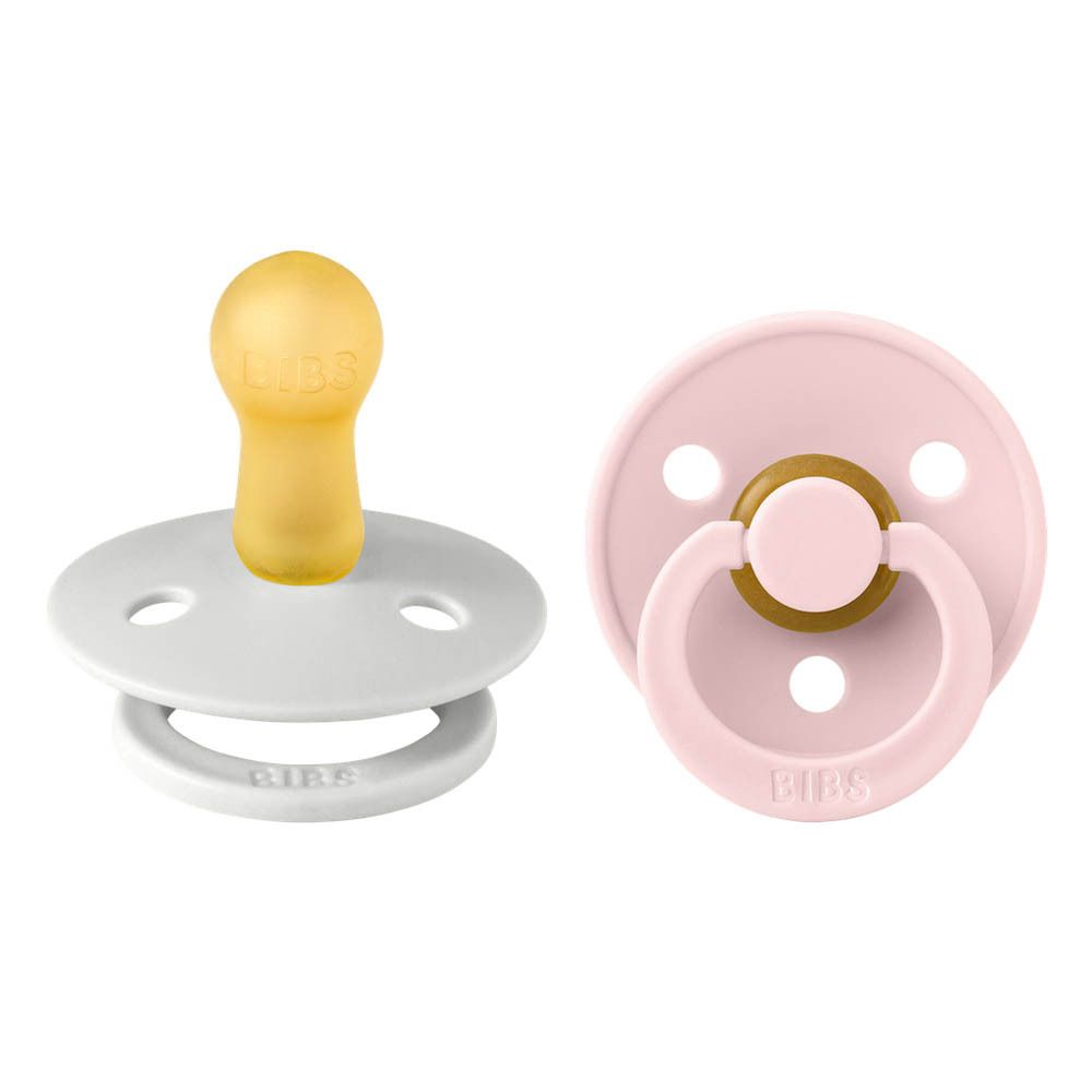 Twee fopspenen. Eén lichtgrijs, één roze. Beide met gele speen en ring. Merk BIBS.