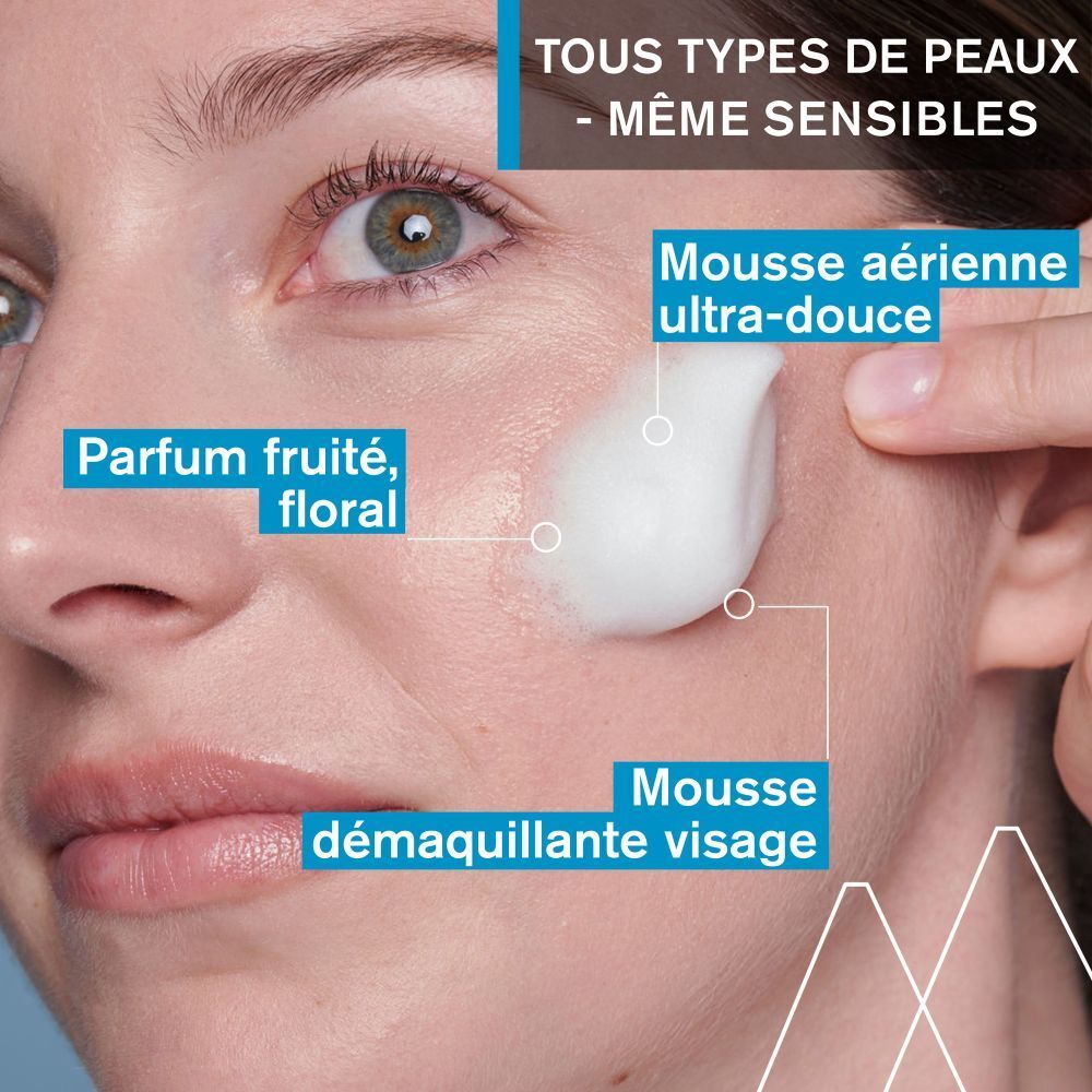 Dos du flacon avec texte. Liquide bleu, bouchon blanc. Texte en plusieurs langues.
