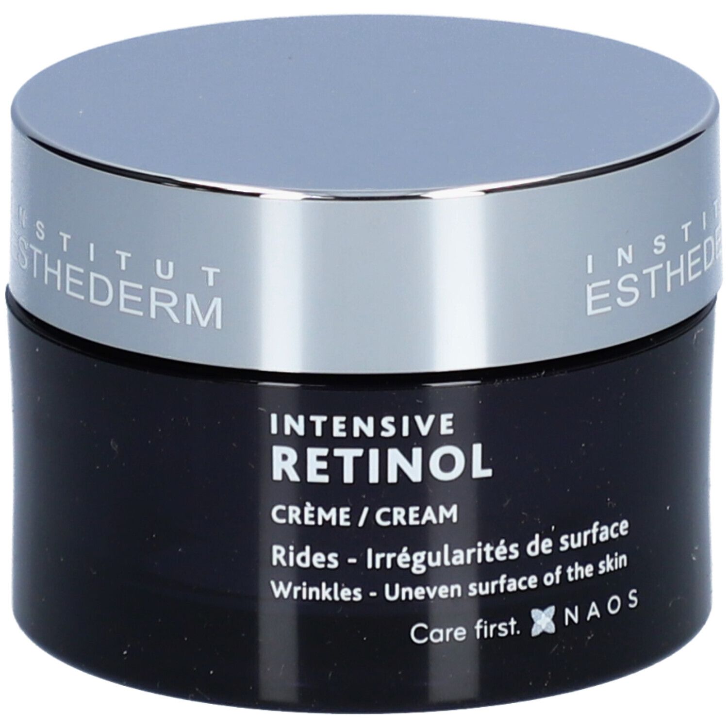 Donkerblauwe crèmepot met zilveren deksel. Opschrift: Institut Esthederm, Intensive Retinol Crème. Tegen rimpels en onregelmatigheden.