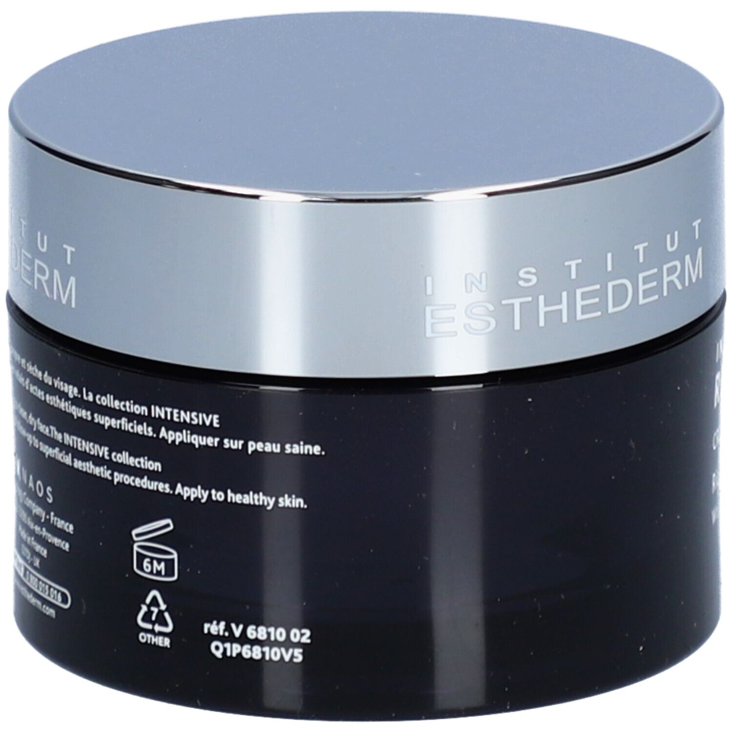 Donkerblauwe crèmepot met zilveren deksel. Opschrift: Institut Esthederm. Achterkant met tekst en symbolen. 6M-symbool.