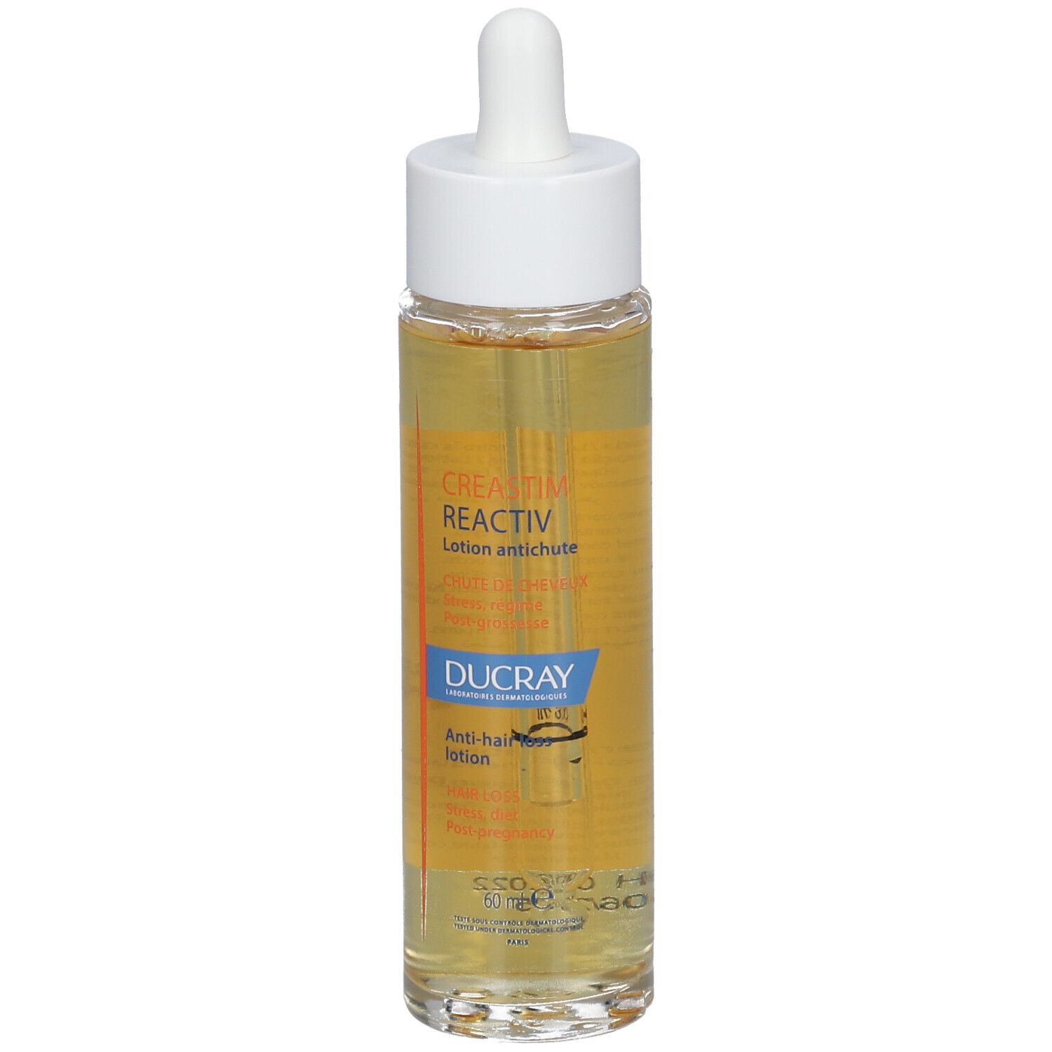 Flacon en verre avec bouchon blanc et pipette. Inscription: CREASTIM REACTIV, DUCRAY.
