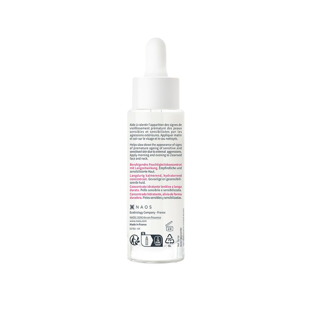 Flacon de sérum avec pipette et goutte. Verre blanc, bouchon blanc. Inscription : Bioderma Sensibio Defensiv Serum.