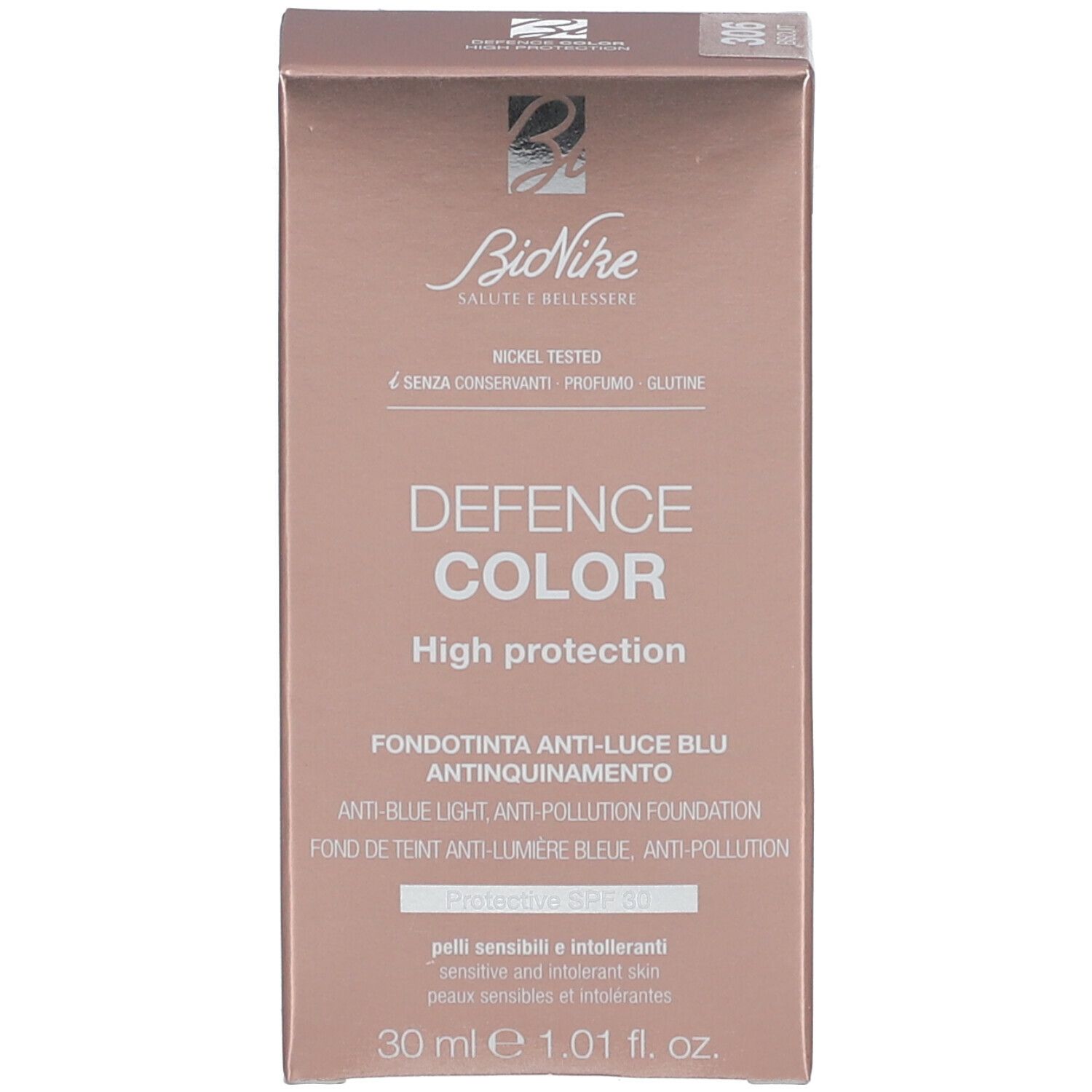Verpakking van het foundationproduct. Opschrift: Bionike, Defence Color, High Protection, 30 ml. Nickel Tested.