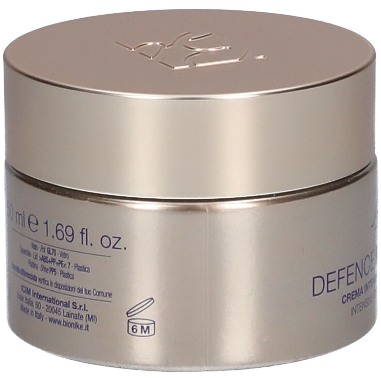 Goldfarbener Creme-Tiegel mit Deckel. Aufschrift: 50 ml e 1.69 fl. oz. Informationen zur Zusammensetzung.