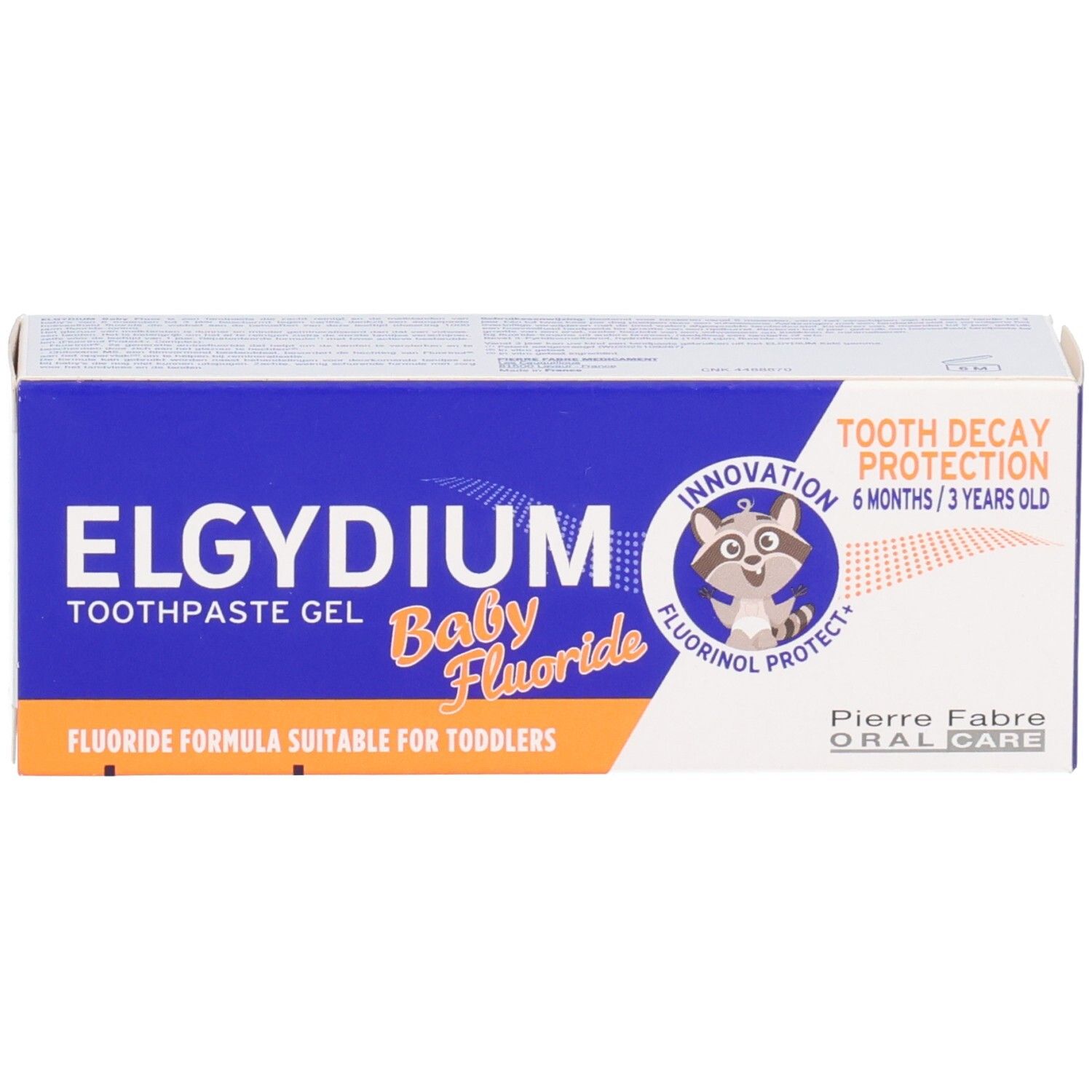 Verpackungsbox Elgydium Baby Fluor Zahnpasta-Gel mit Waschbär-Logo und Hinweisen zum Kariesschutz.