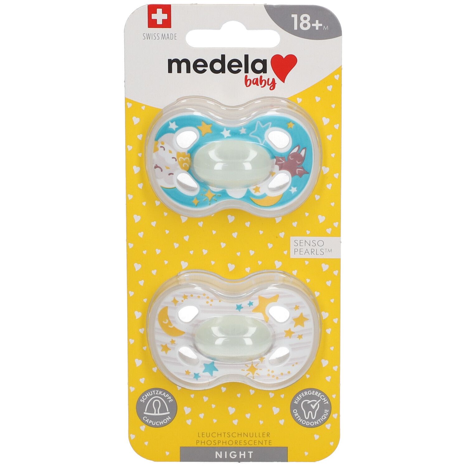 Deux sucettes en blister. Bleu clair et transparent, motif étoiles. Tétines phosphorescentes. Marque Medela Baby.