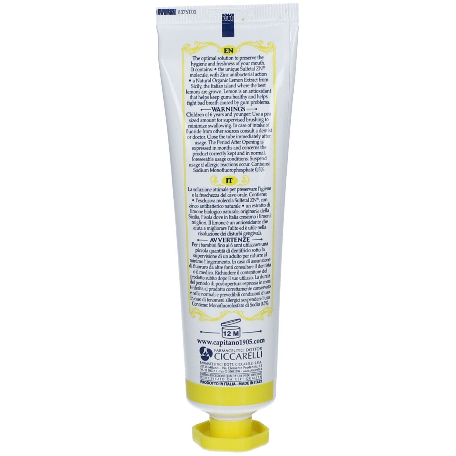 Rückseite der Zahncreme-Tube. Text in mehreren Sprachen. Gelber Verschluss. Hergestellt in Italien.