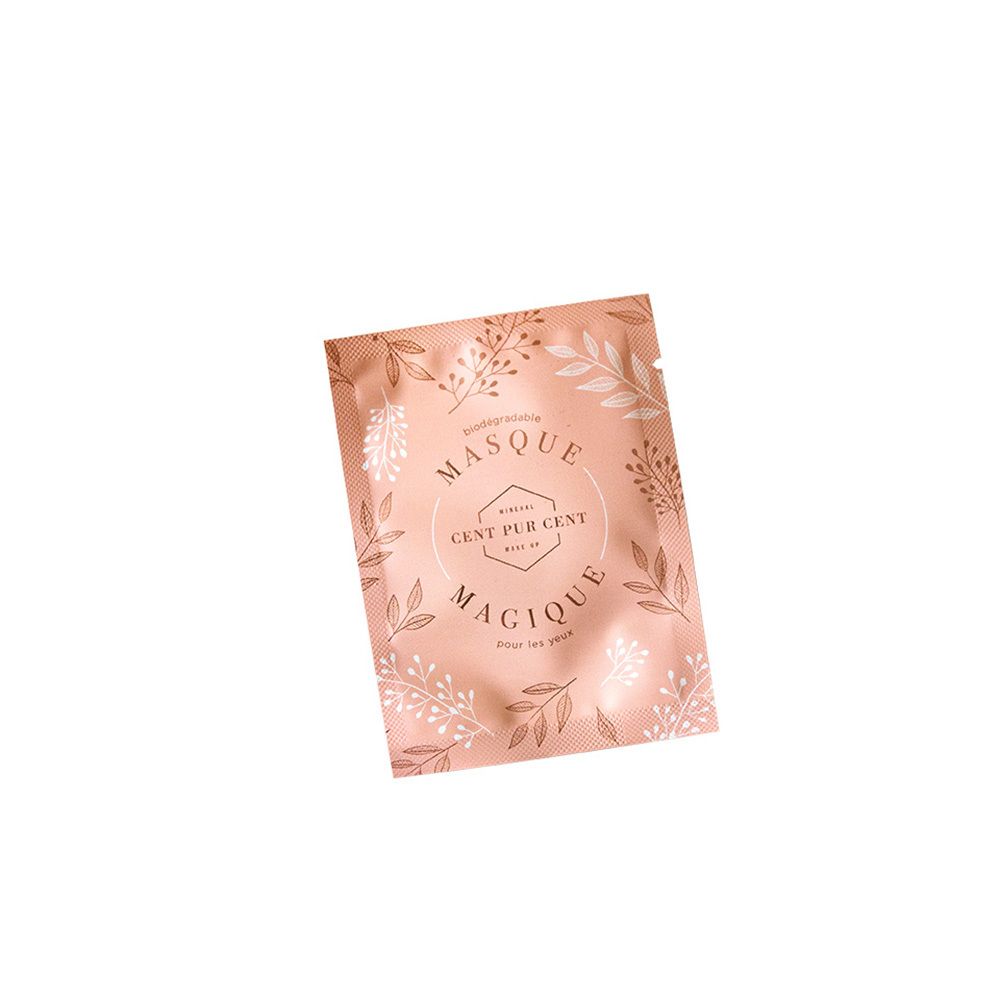 Roze verpakking met bloemmotief. Tekst: Masque Magique pour les yeux, Cent Pur Cent.