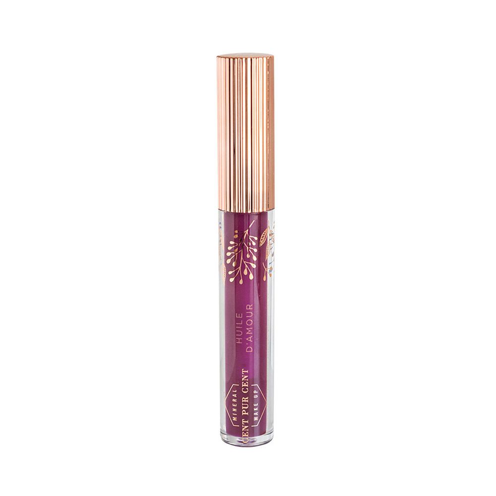 Tube d'huile pour les lèvres avec bouchon or rose. Inscription : HUILE D'AMOUR, CENT PUR CENT. Huile couleur prune.