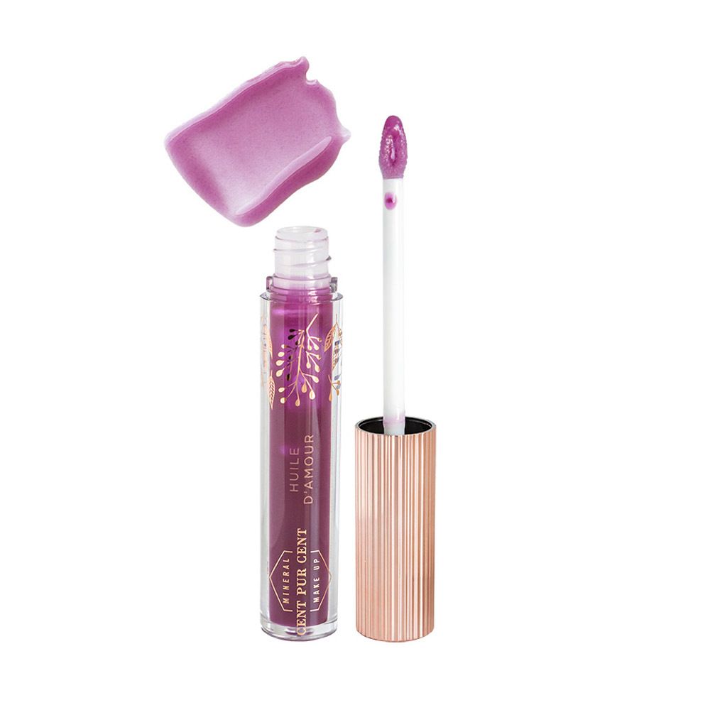Tube d'huile pour les lèvres, applicateur et échantillon de couleur. Huile couleur prune. Bouchon or rose.