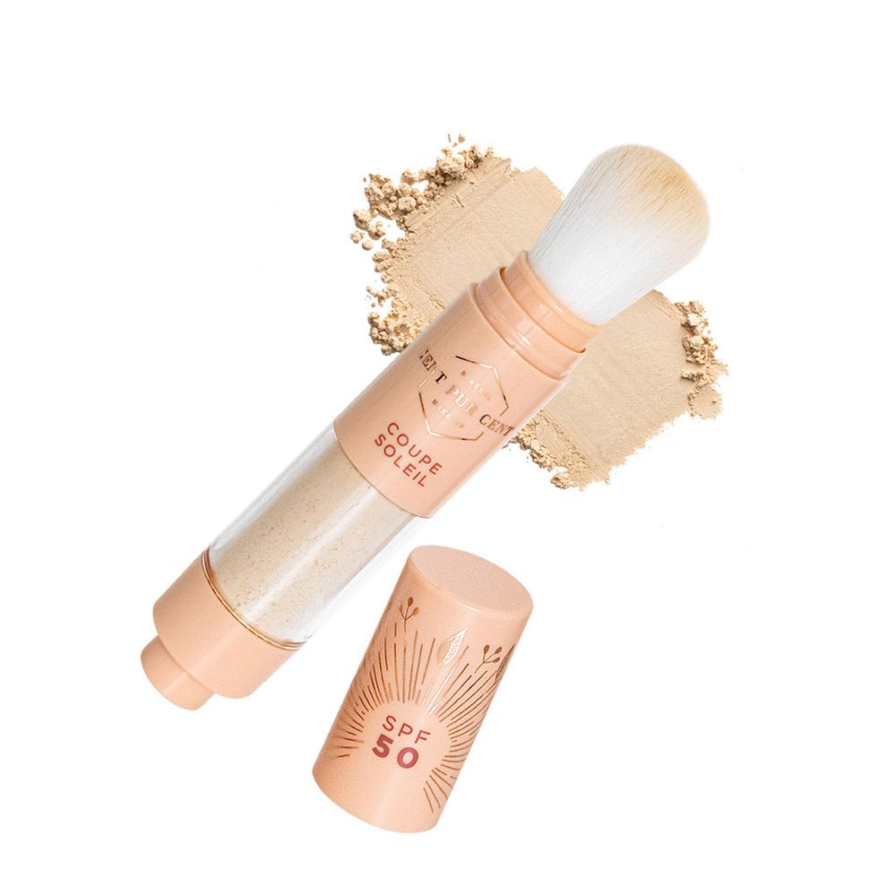 Poederapplicator en poeder. Cilindrisch product met SPF 50. Poeder op oppervlak.