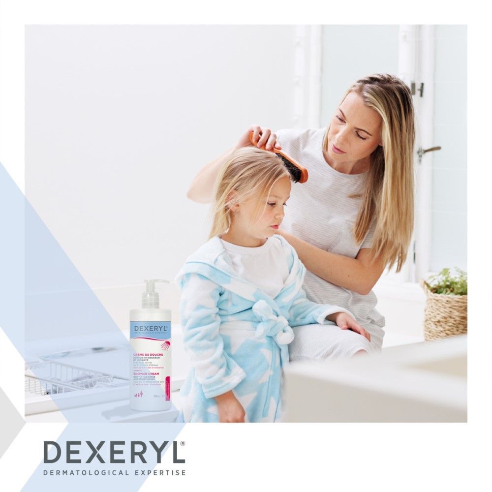 Dexeryl Crème de Douche Flasche neben Mutter und Kind. Produktabbildung.