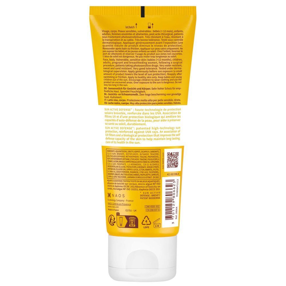 Dos d'un tube jaune. Sections de texte en plusieurs langues. Code QR et logos. Bouchon blanc.