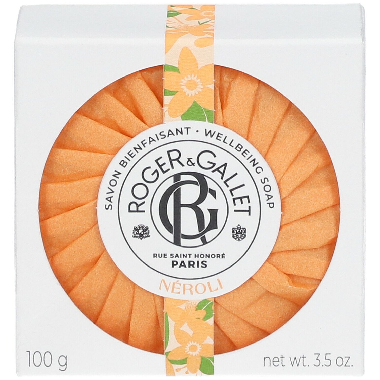 Savon rond orange dans une boîte blanche. Marque Roger & Gallet, Néroli. Emballage avec ruban floral.