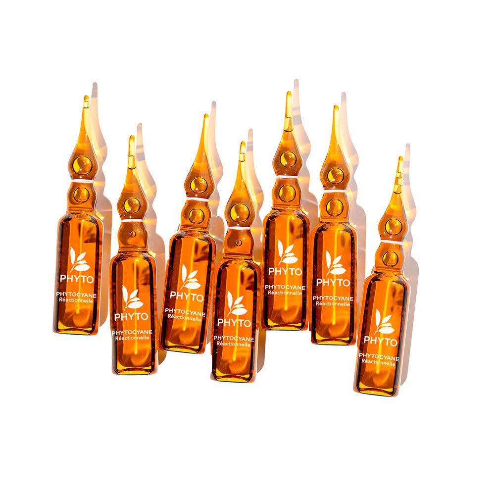 Sieben Phyto Phytocyane Ampullen mit goldener Flüssigkeit, auf weißem Hintergrund.