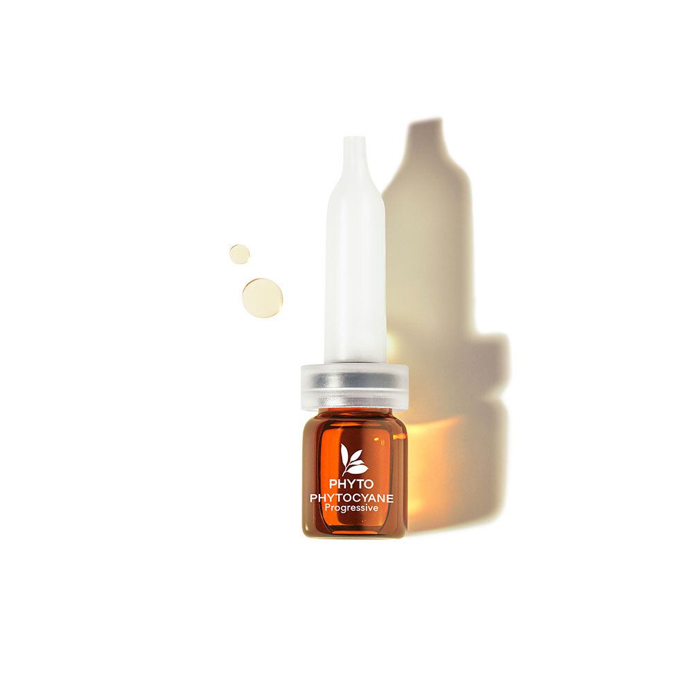 Braune Ampulle mit weißem Applikator. Produktname PHYTO PHYTOYANE. Auf hellem Hintergrund.