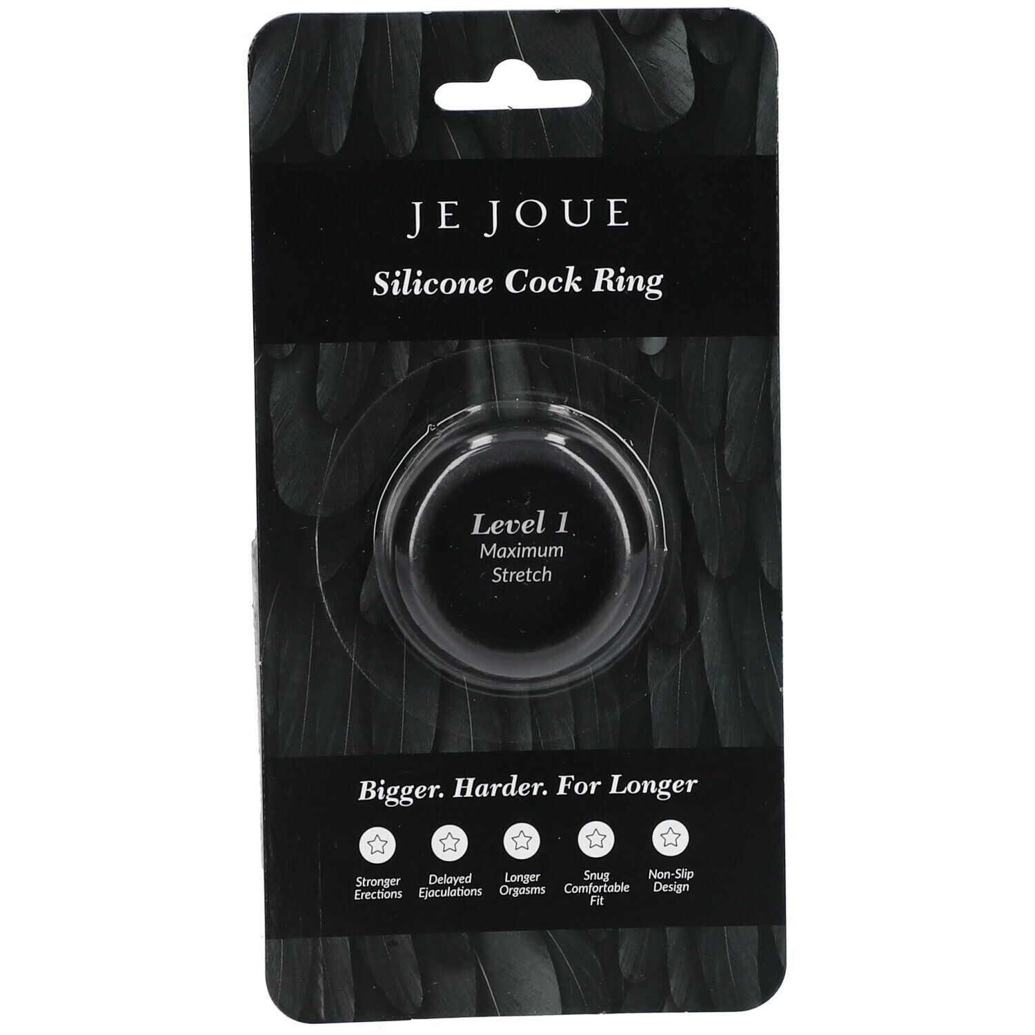 Emballage noir avec cockring. Texte: Je Joue, Silicone Cock Ring, Level 1 Maximum Stretch. Caractéristiques: plus fort, plus longtemps, etc.
