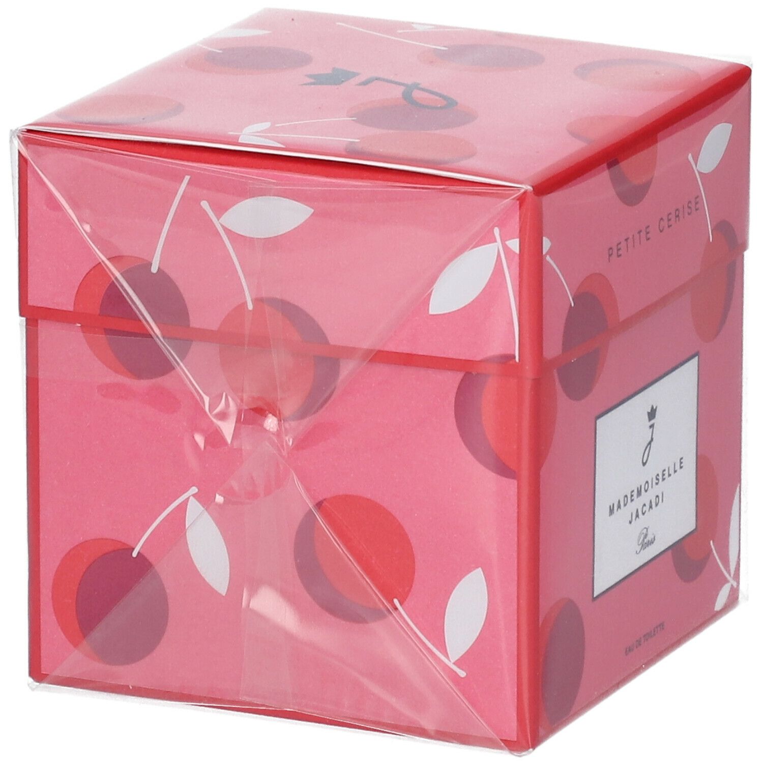 Boîte rose à motif cerise, emballée dans du film plastique. Inscription : Petite Cerise. Informations produit sur étiquette blanche.