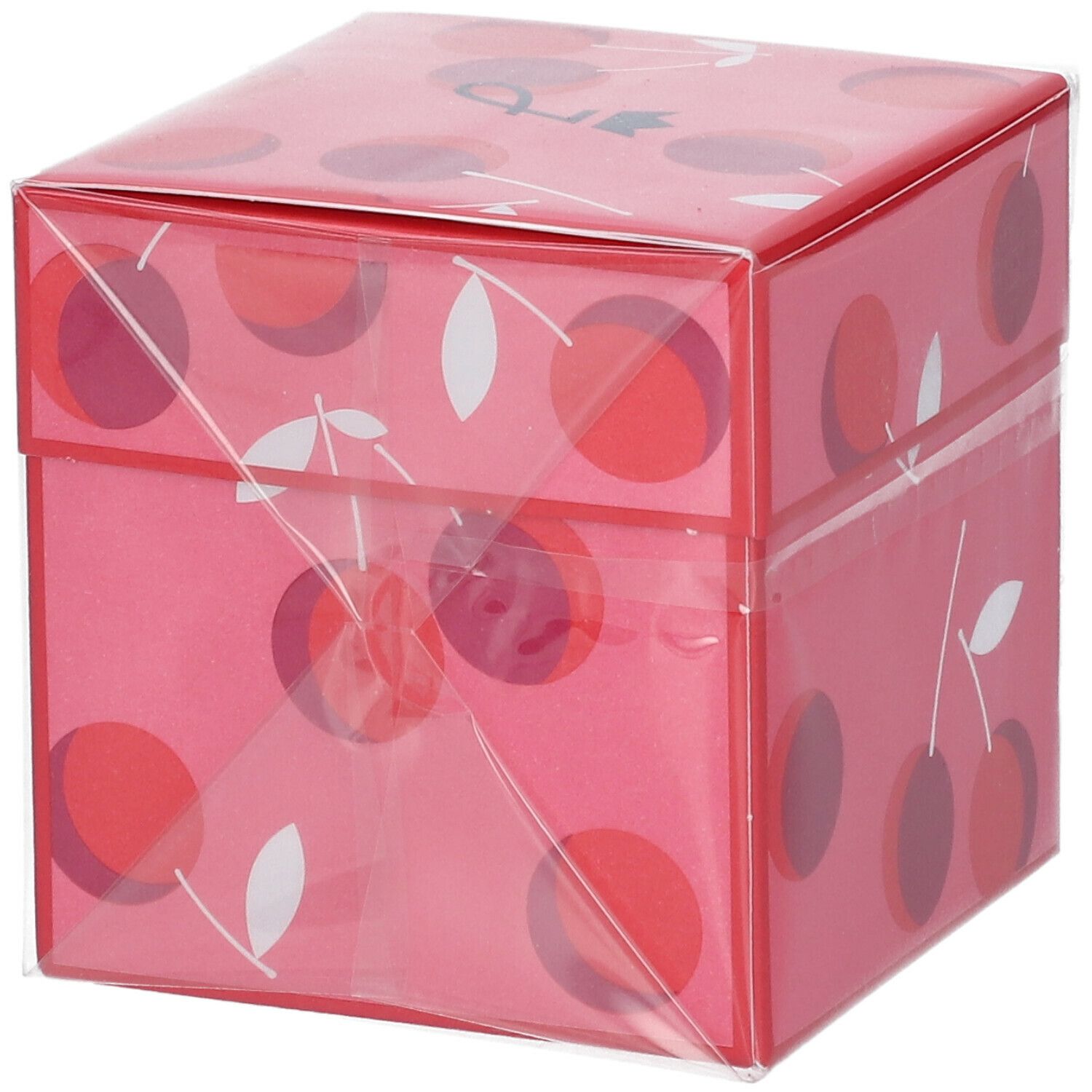 Boîte rose à motif cerise, emballée dans du film plastique. Moitié supérieure de la boîte visible. Aucune information produit.