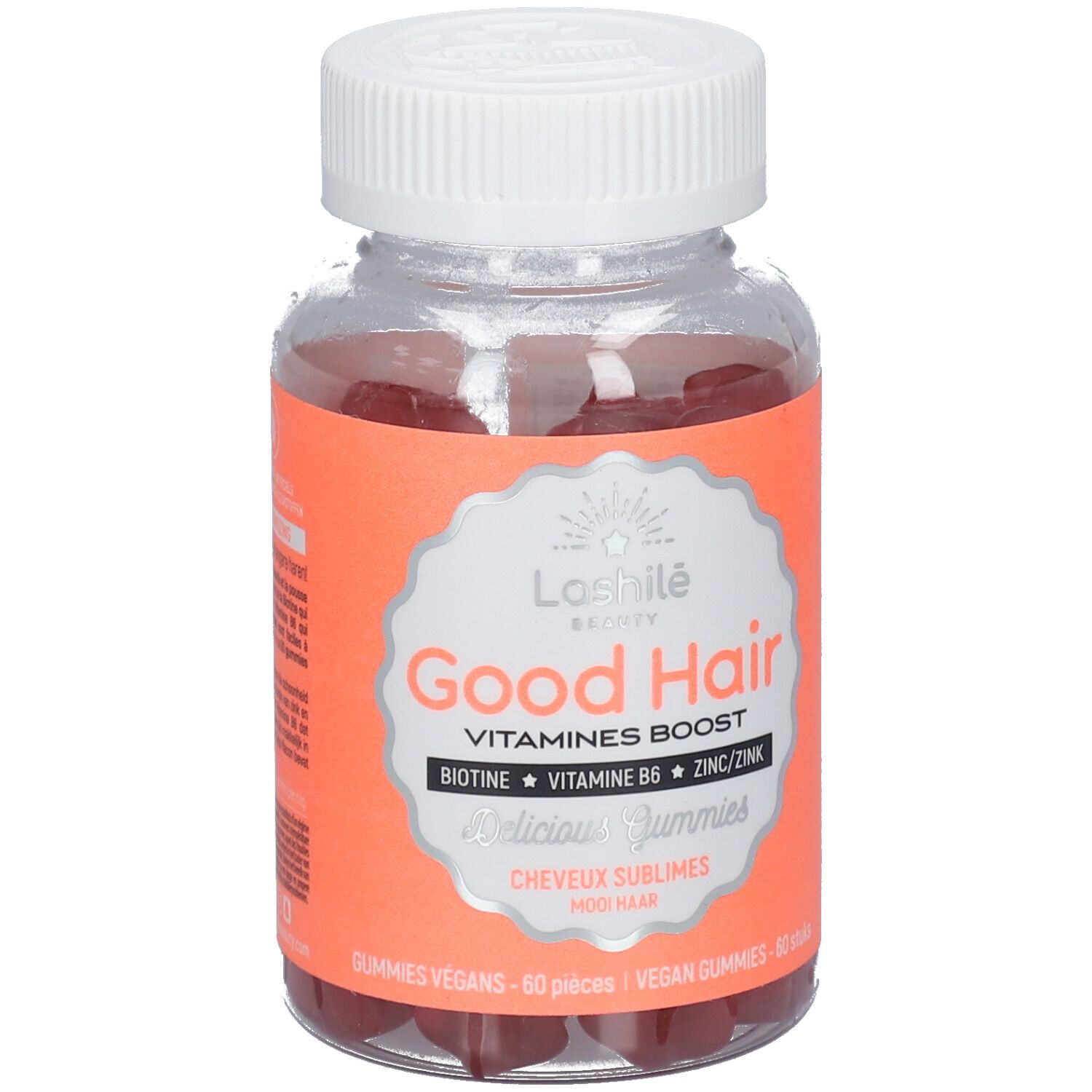 Flacon transparent de gummies rouges. Étiquette "Good Hair" et ingrédients. Bouchon blanc.