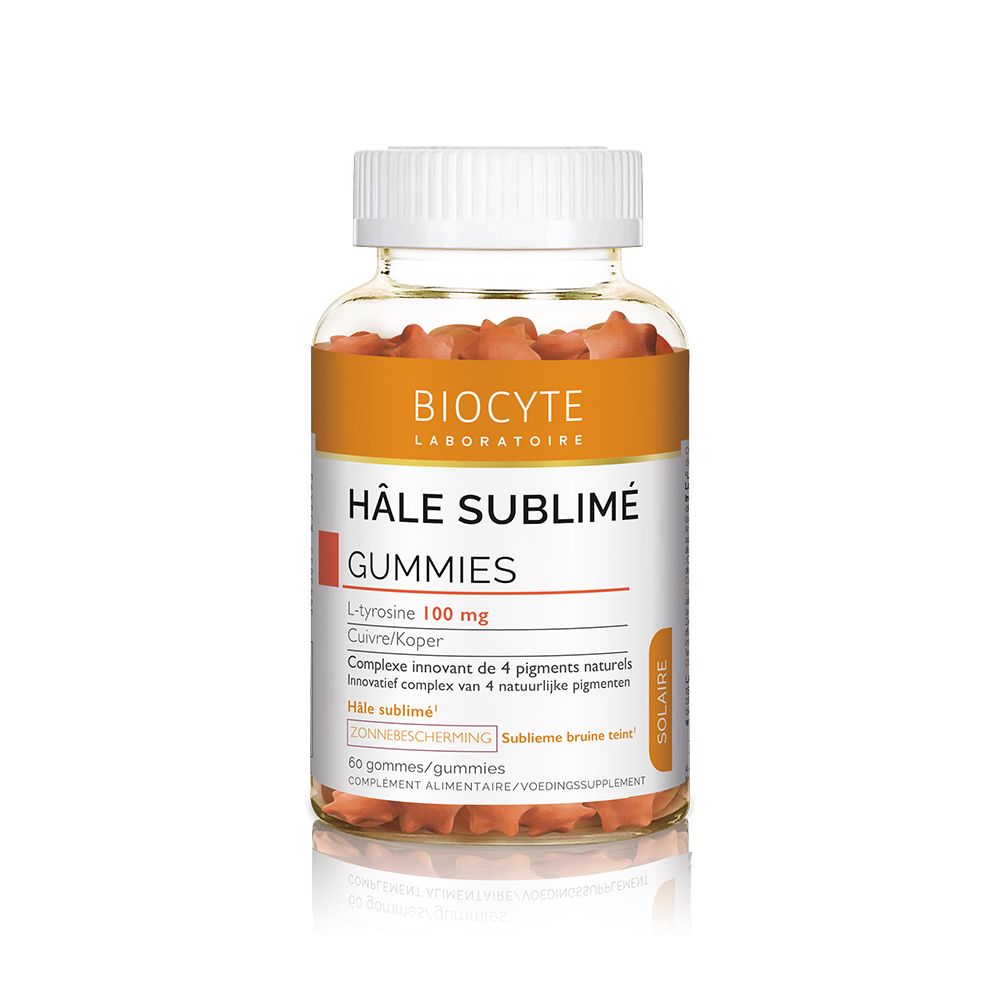 Flacon transparent avec bouchon blanc. Étiquette orange avec nom et marque du produit. Gummies rouges visibles.