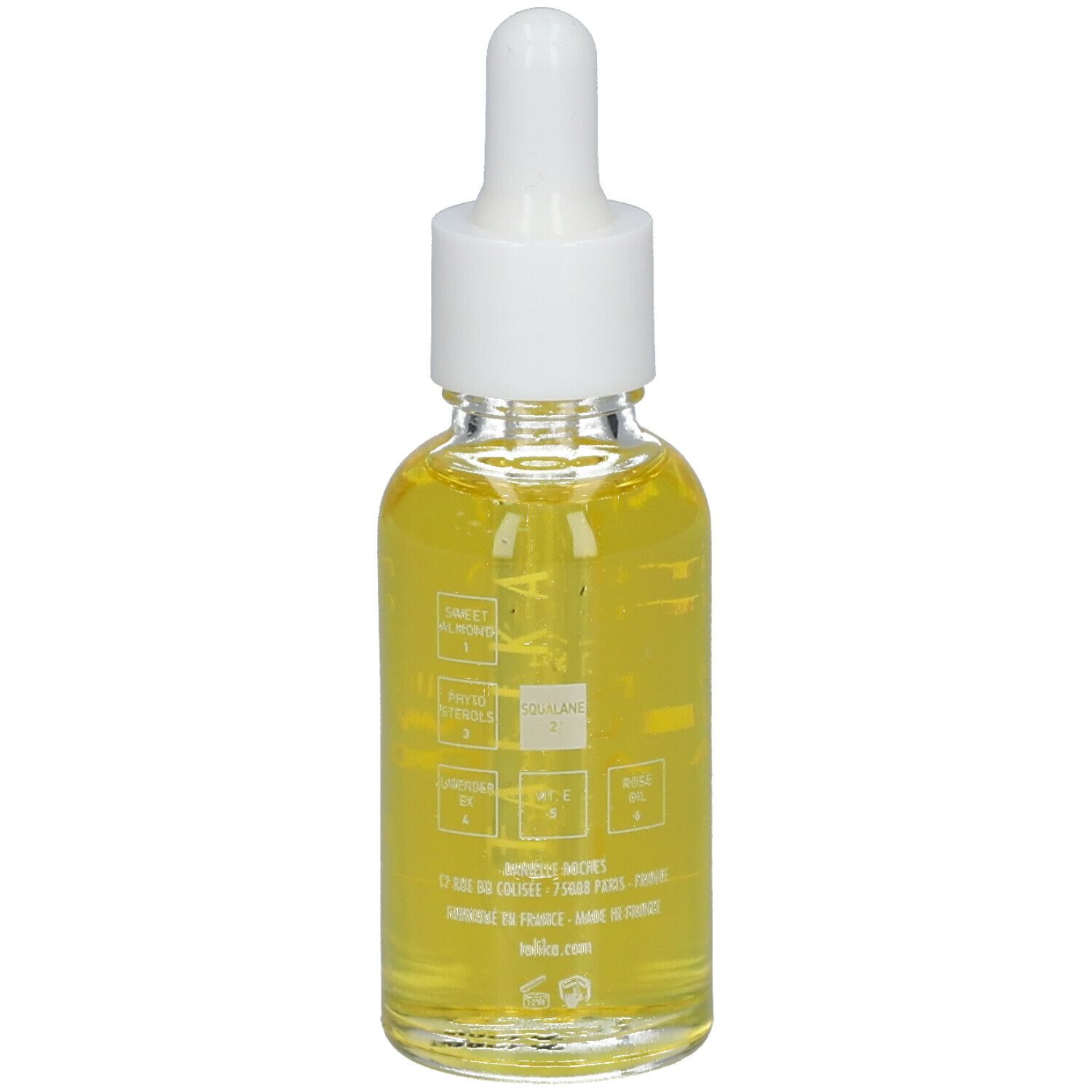 Dos d'un flacon en verre d'huile jaune avec pipette. Inscription: Skintelligence Huile Vitale Vital Oil. Informations.