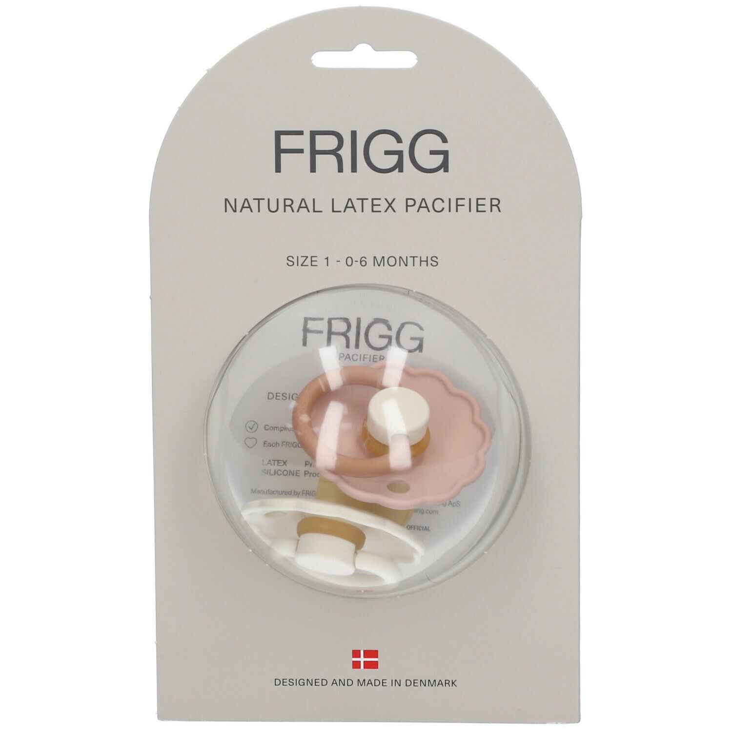 FRIGG, sucette. Sucette rose et crème dans un emballage. Texte: Natural Latex Pacifier, 1-6 mois.