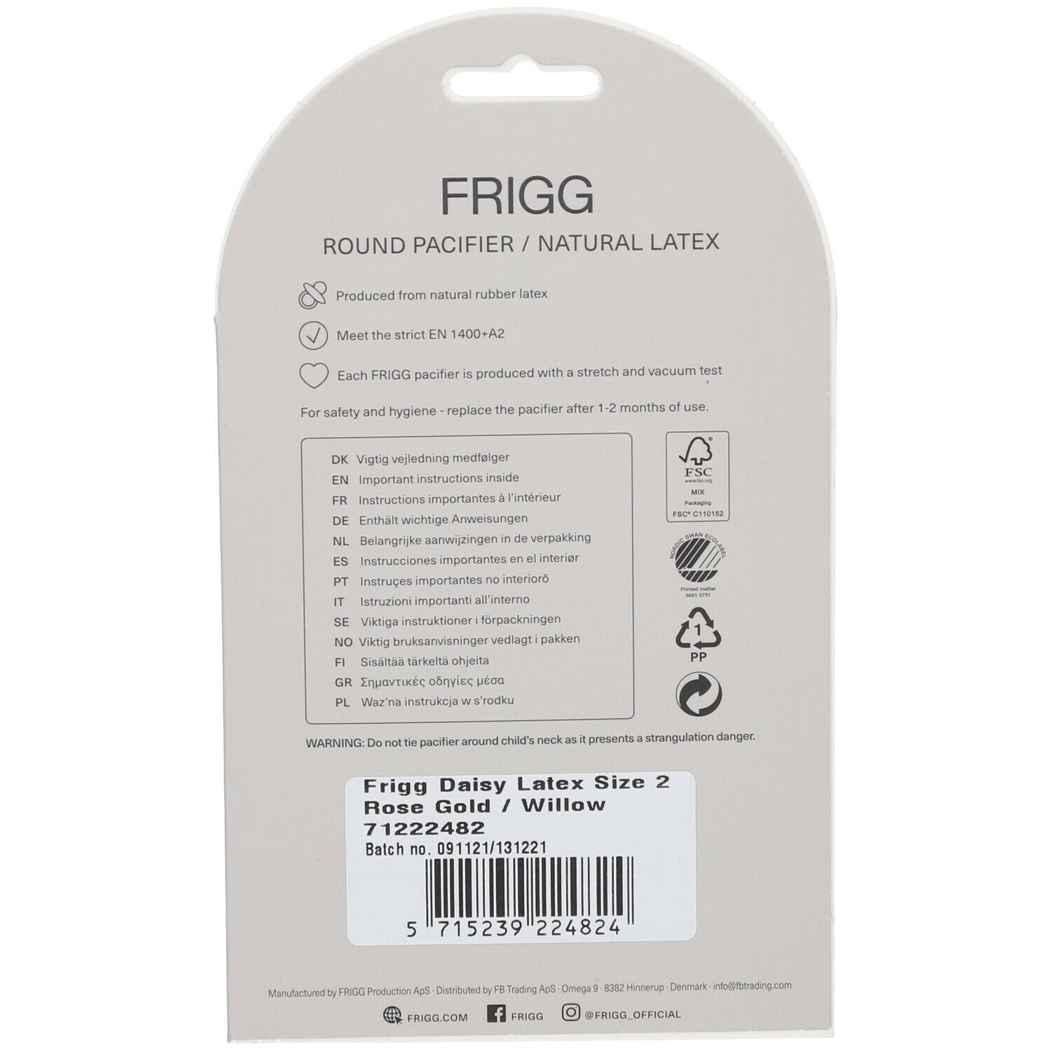 Dos de l'emballage. Texte : FRIGG, ROUND PACIFIER / NATURAL LATEX. Informations sur le matériau et la sécurité. Étiquette avec nom du produit.