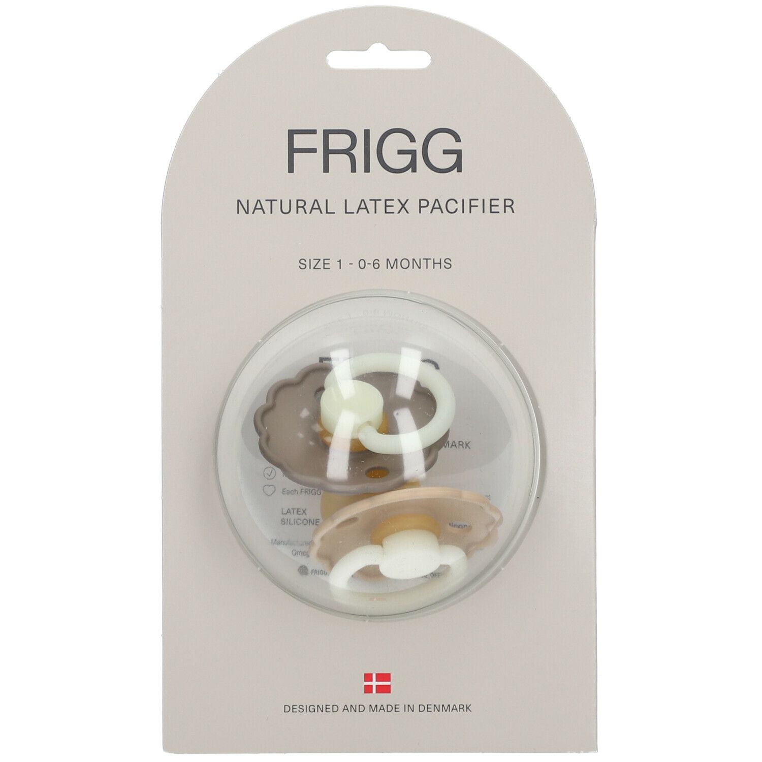 Emballage de deux sucettes FRIGG. Texte: Natural Latex Pacifier, Size 1-6 Months. Sucettes dans un emballage plastique.